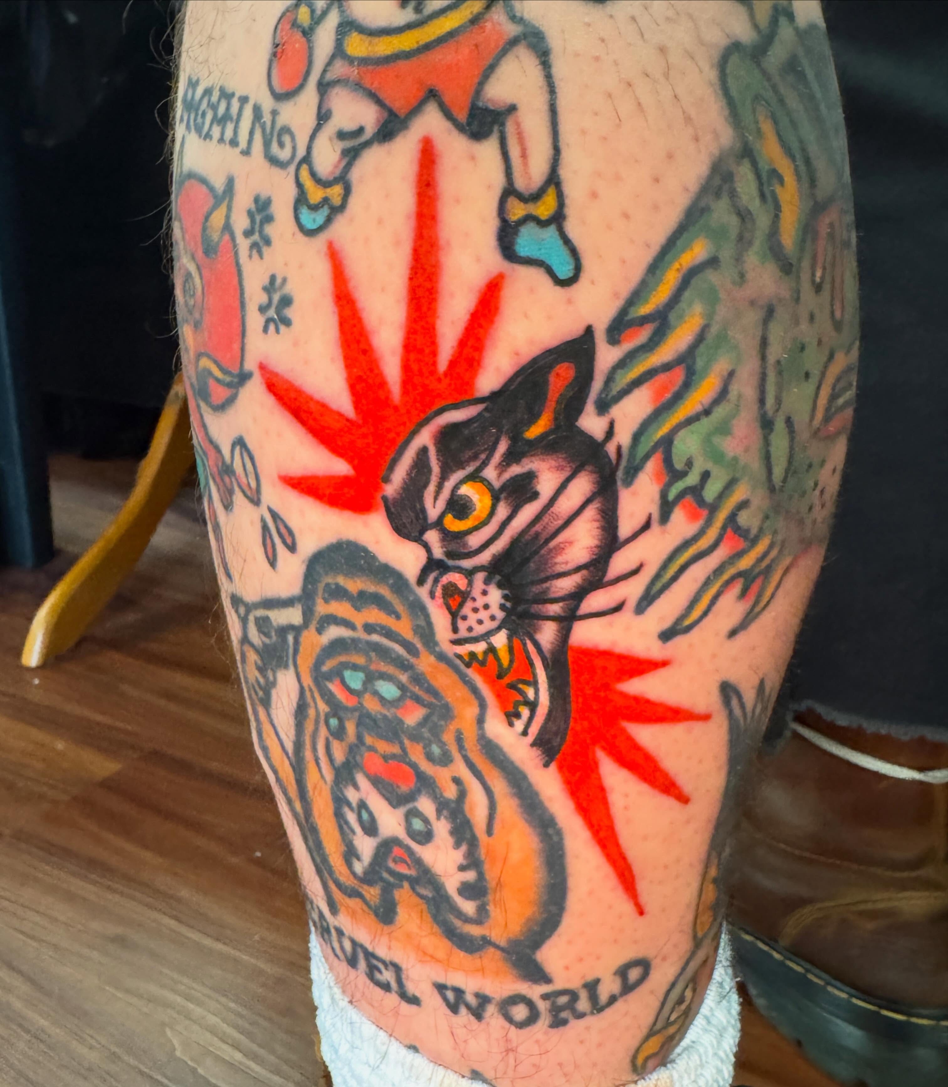 Cat and tiger American traditional tattoo on the forearm by Harrison ♠️