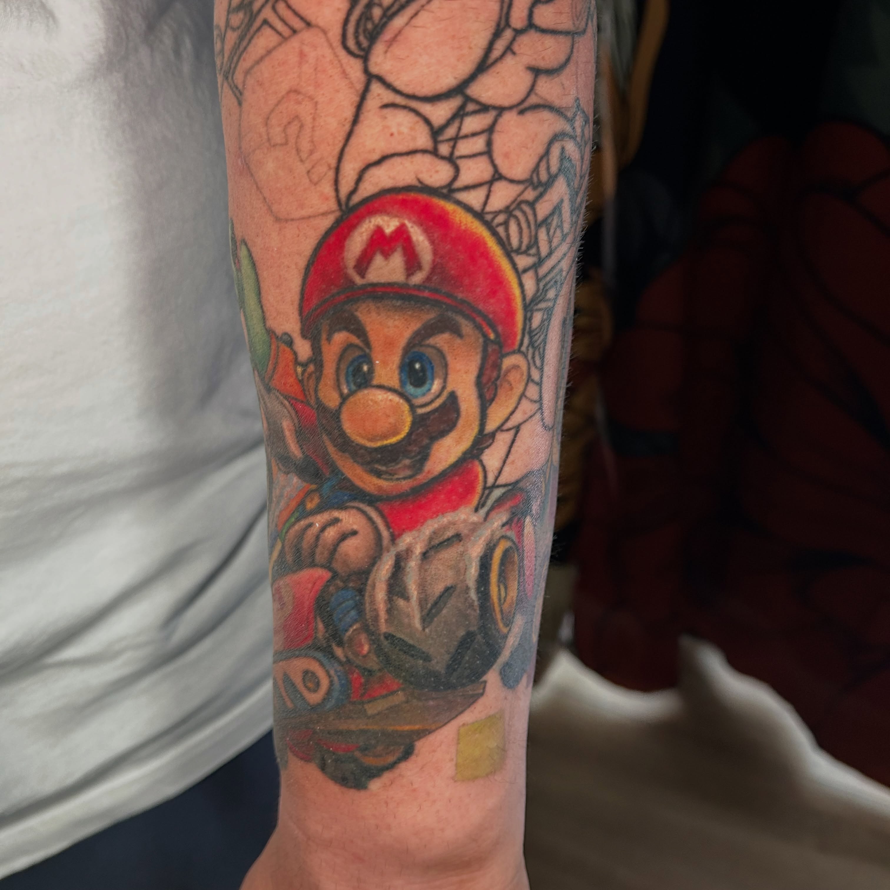 Mario kart new school tattoo on the forearm by Paisley Diaz, Lombard, Illinois