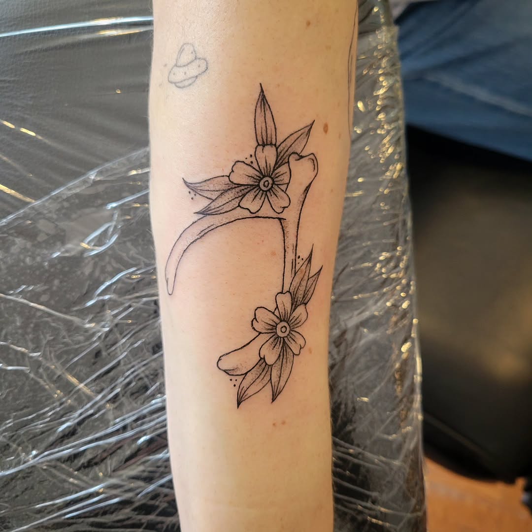 Antler with flowers fine line tattoo on the forearm by Solstice Tattoos by Savannah Sadler (future, Salisbury, North Carolina