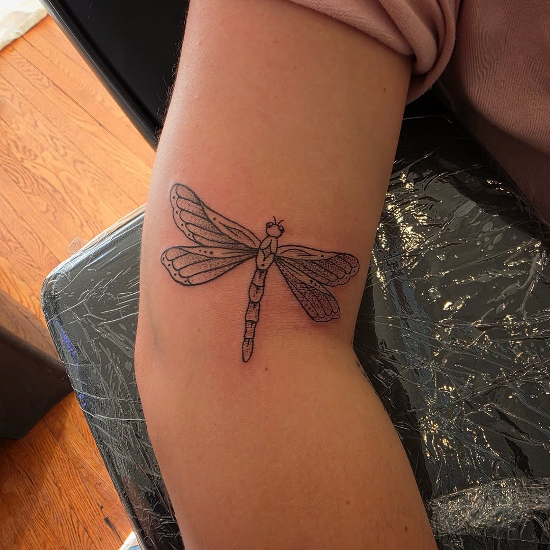 Dragonfly fine line tattoo on the forearm by Solstice Tattoos by Savannah Sadler (future, Salisbury, North Carolina