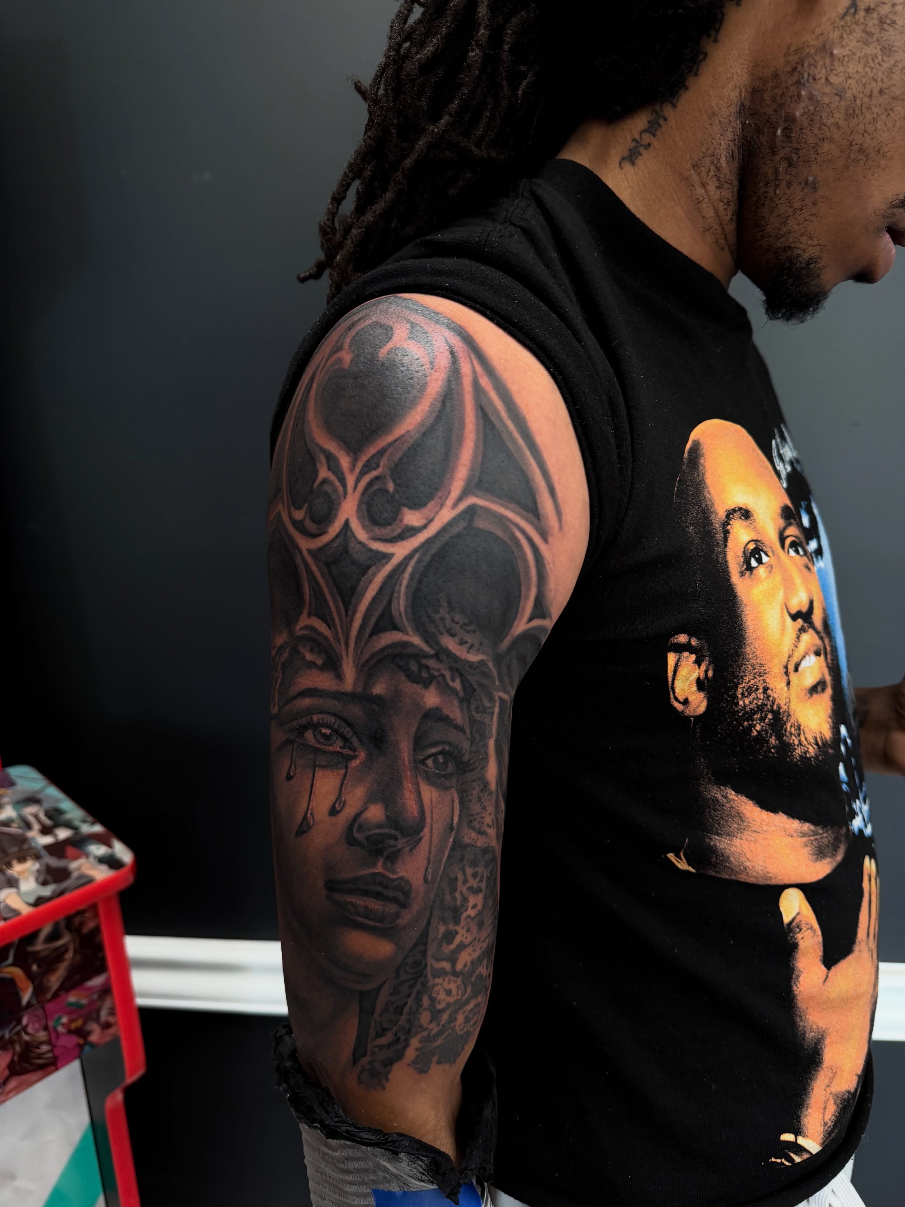 Woman's face realism tattoo on the upper arm by Michigan📍 Day Sessions $850, Wayne, Michigan