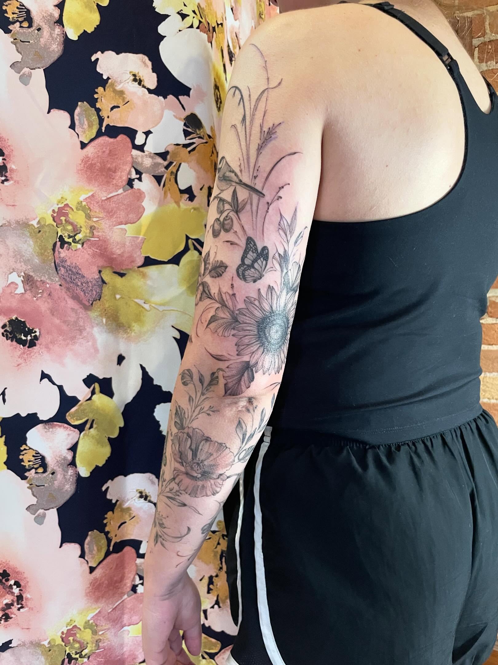 Floral bouquet realism tattoo on the upper arm by paige  l  ink shrink tattoo