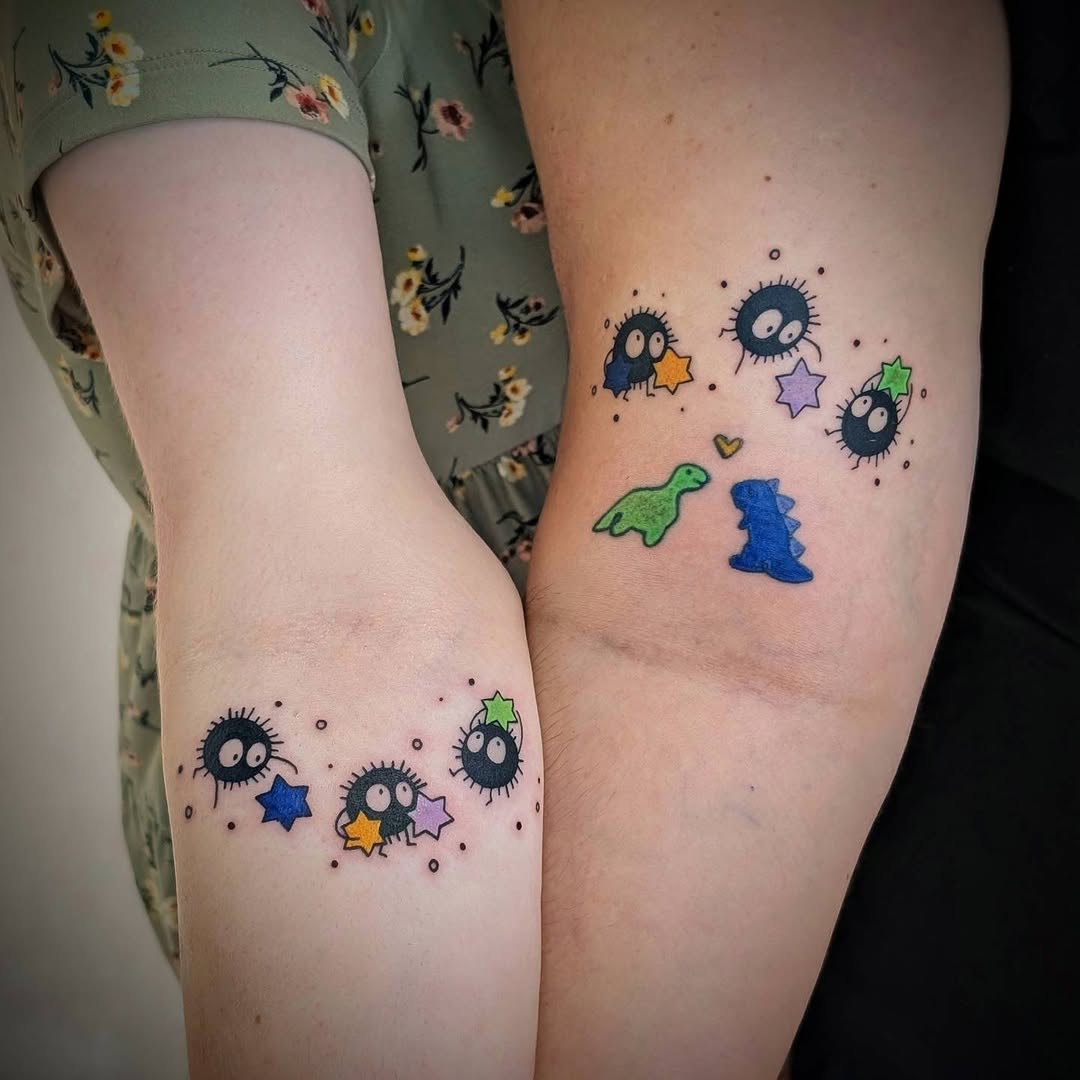 Soot sprites and dinosaurs new school tattoo on the forearm by Rhiannon