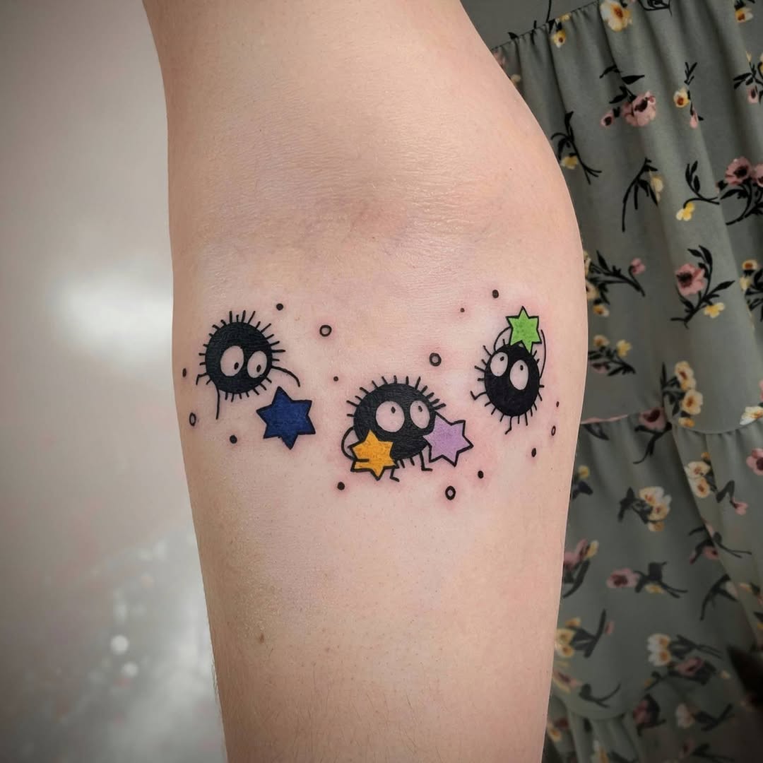 Susuwatari soot sprites with stars new school tattoo on the forearm by Rhiannon