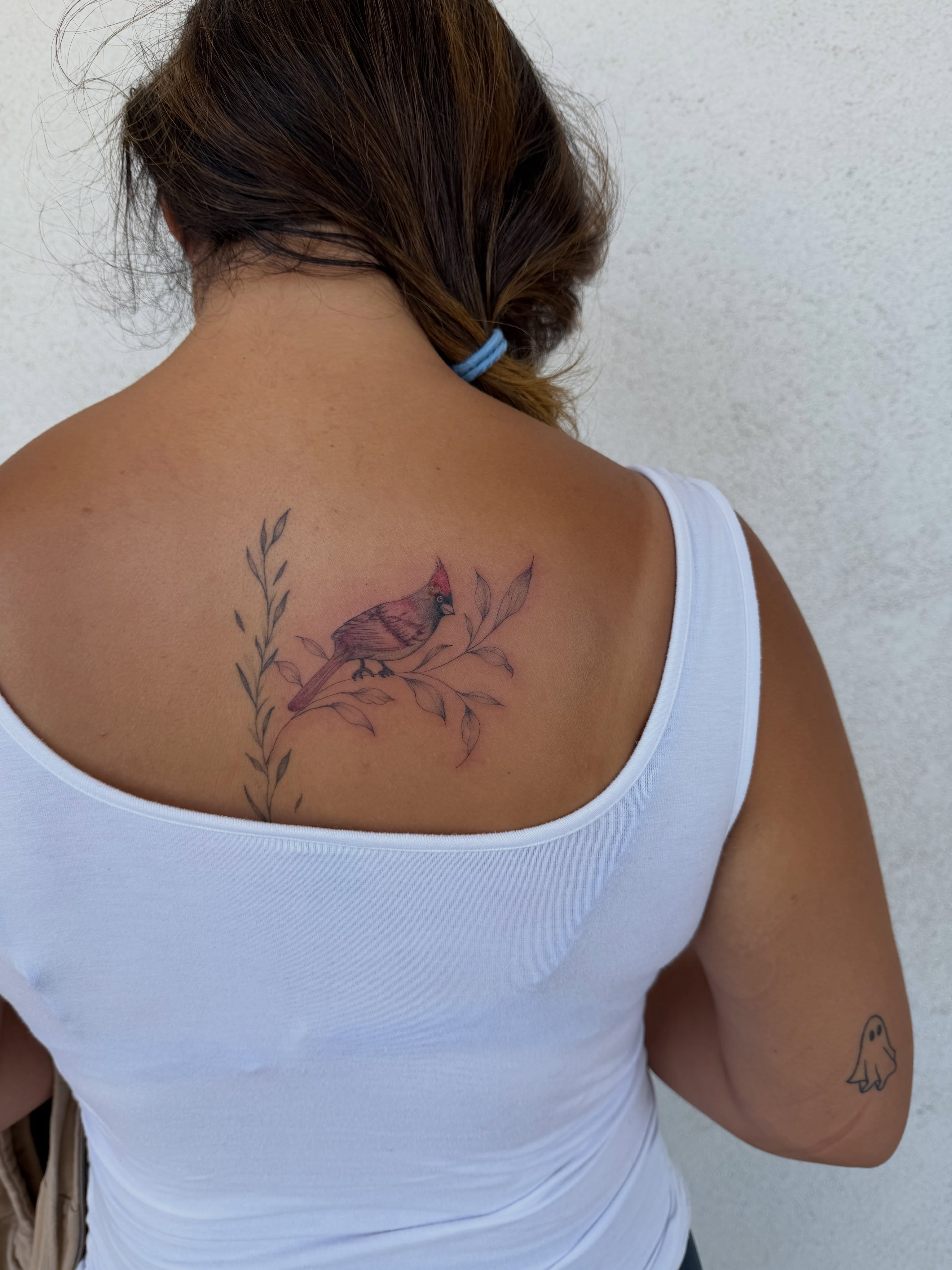 Cardinal bird realism tattoo on the back by Jacksyn, Plano, Texas