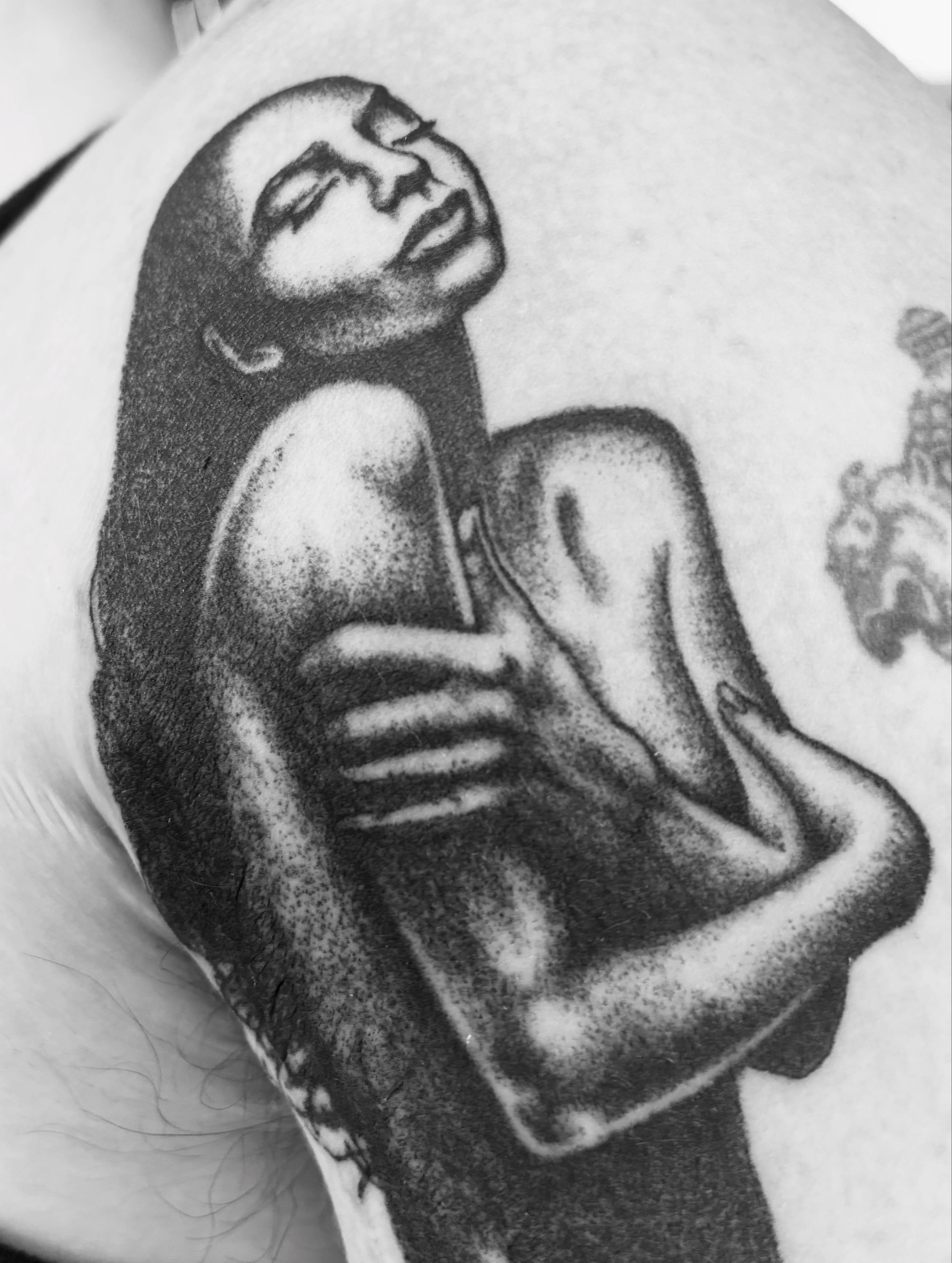 Nude woman dotwork tattoo on the upper arm by Zachary R Bobkoff