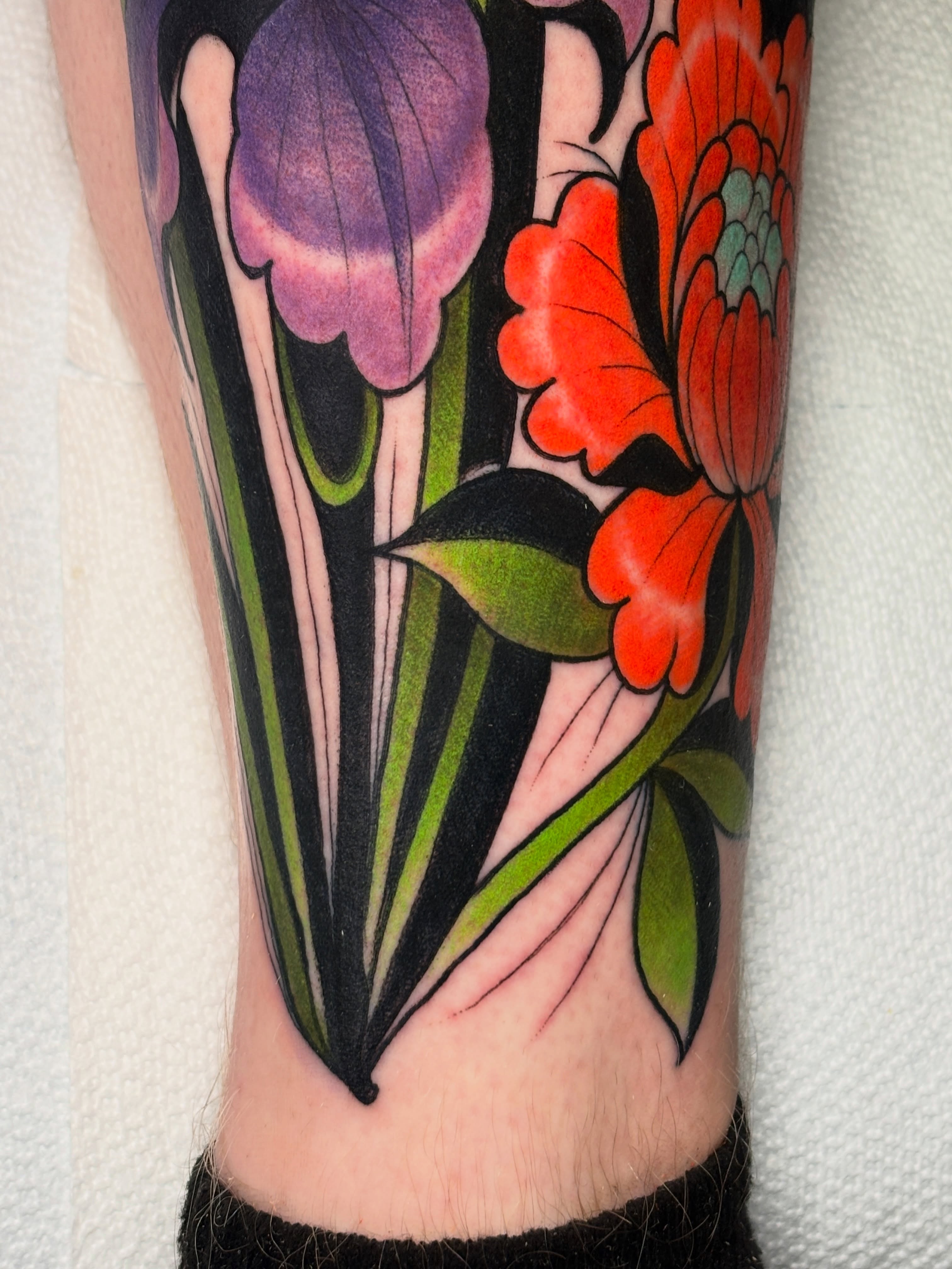 Floral arrangement American traditional tattoo on the calf by Shane Klos