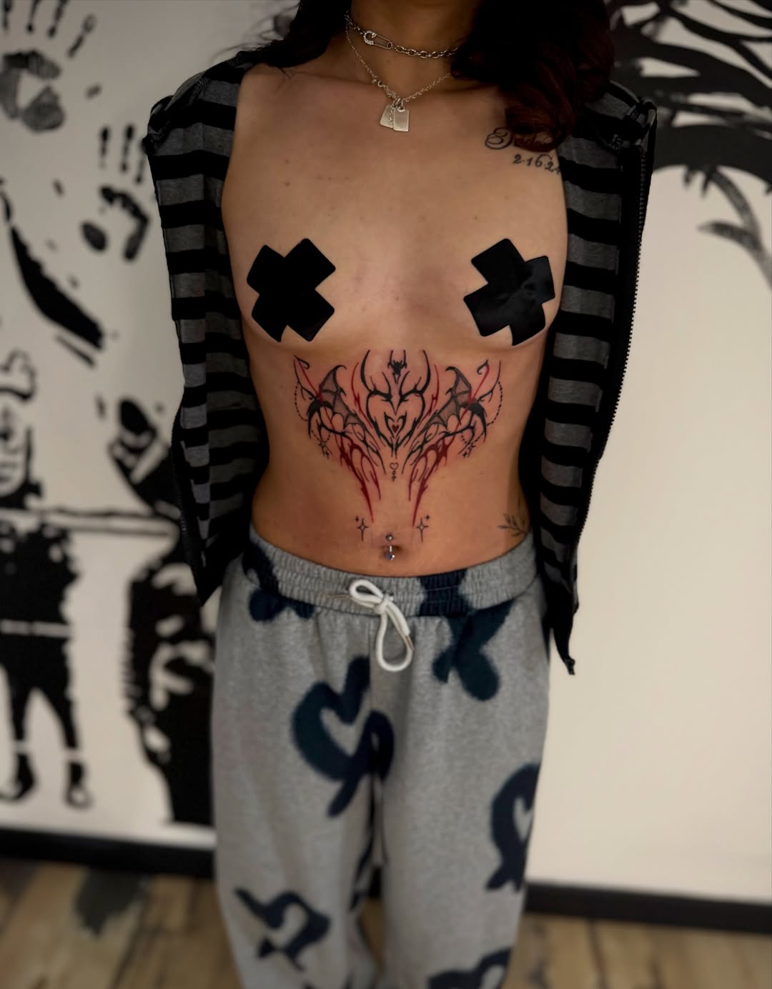Abstract tribal design cyber sigilism tattoo on the torso by K Valentine