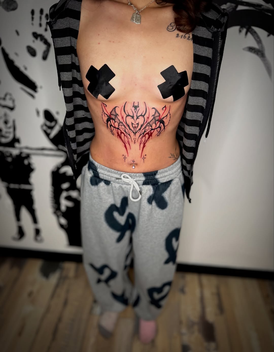 Abstract tribal design cyber sigilism tattoo on the torso by K Valentine