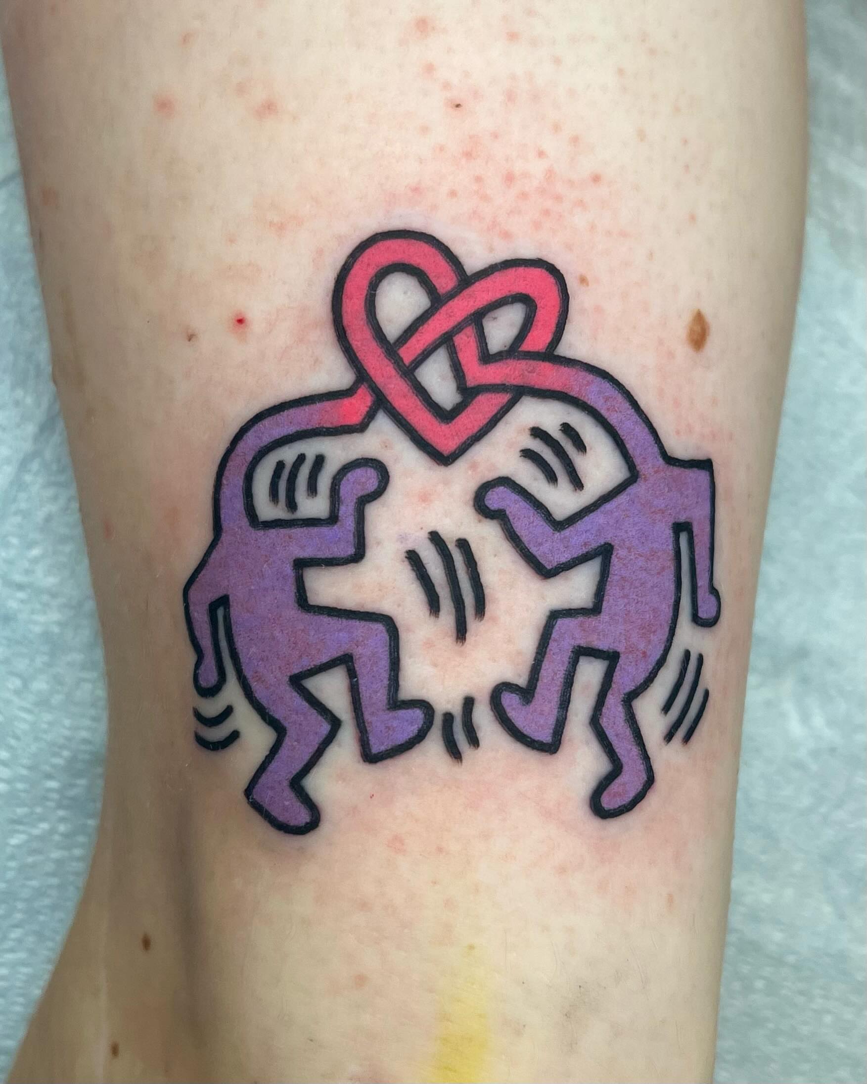 Two figures with heart geometric tattoo on the forearm by Em Adkins