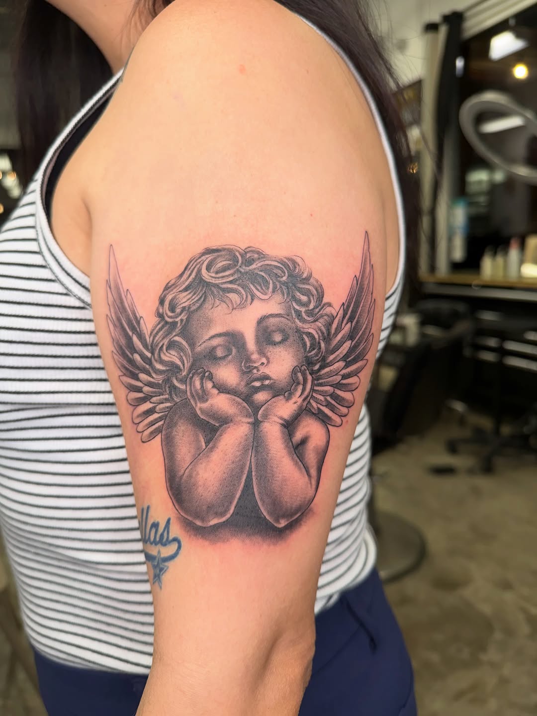 Cherub angel realism tattoo on the shoulder by Ricky Sanchez, Duncanville, Texas