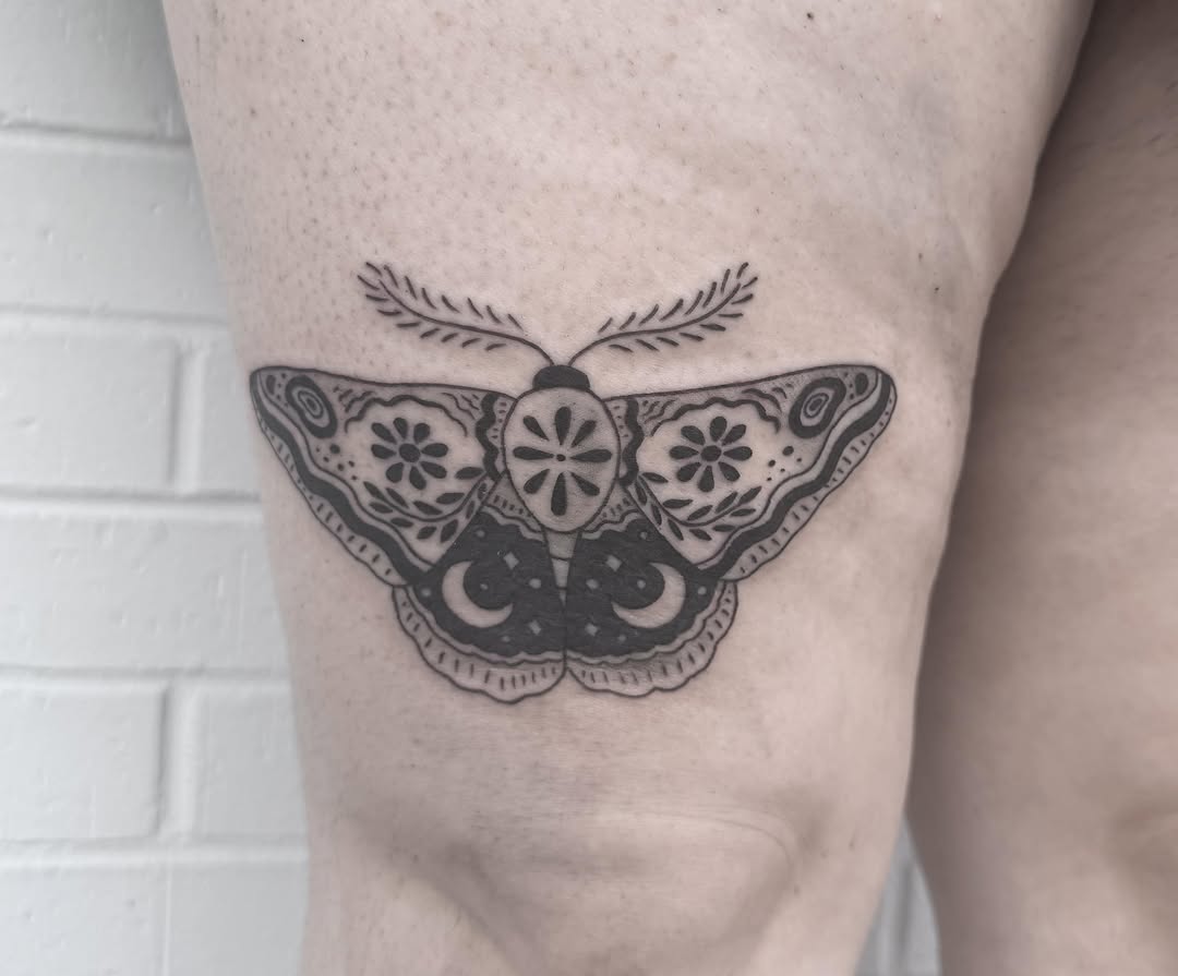 Moth black and grey tattoo on the forearm by Audrey Kacel, Holland, Michigan