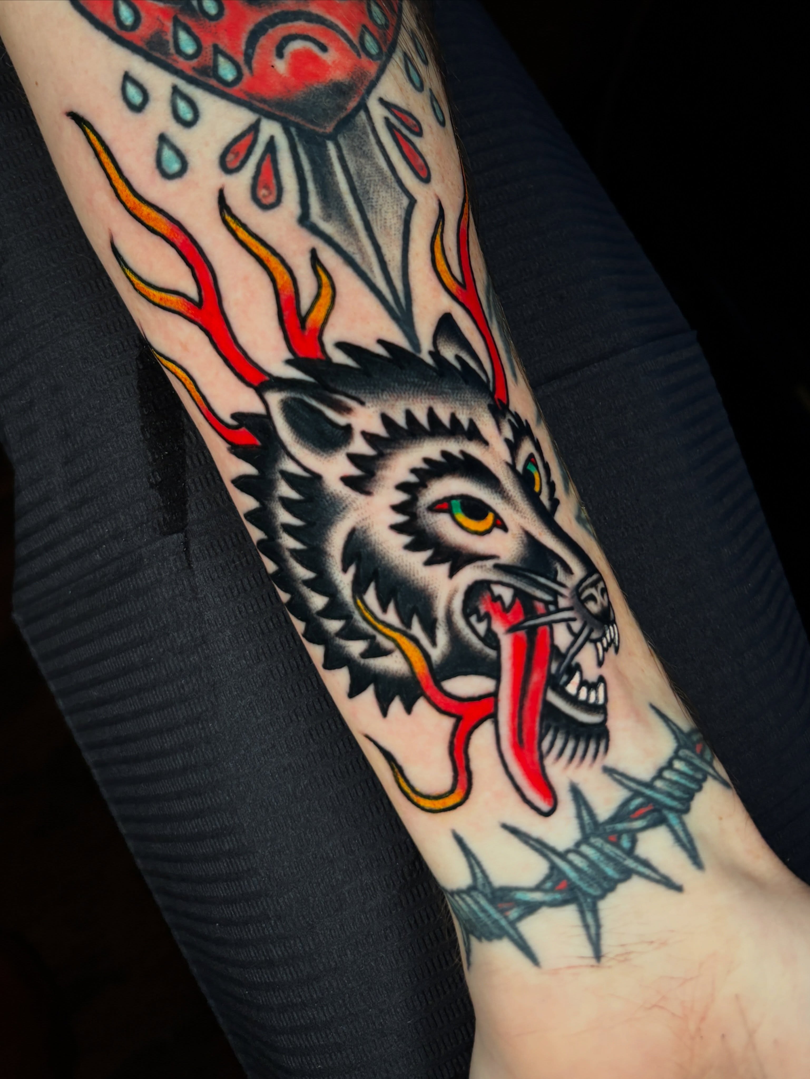 Wolf head American traditional tattoo on the forearm by Max Klapp, Austin, Texas