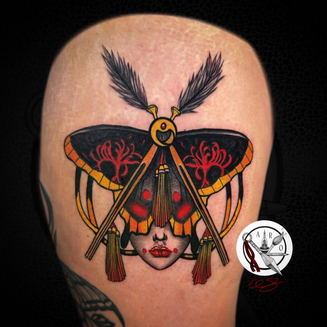 Moth face neo-traditional tattoo on the thigh by Aaron Strobehn