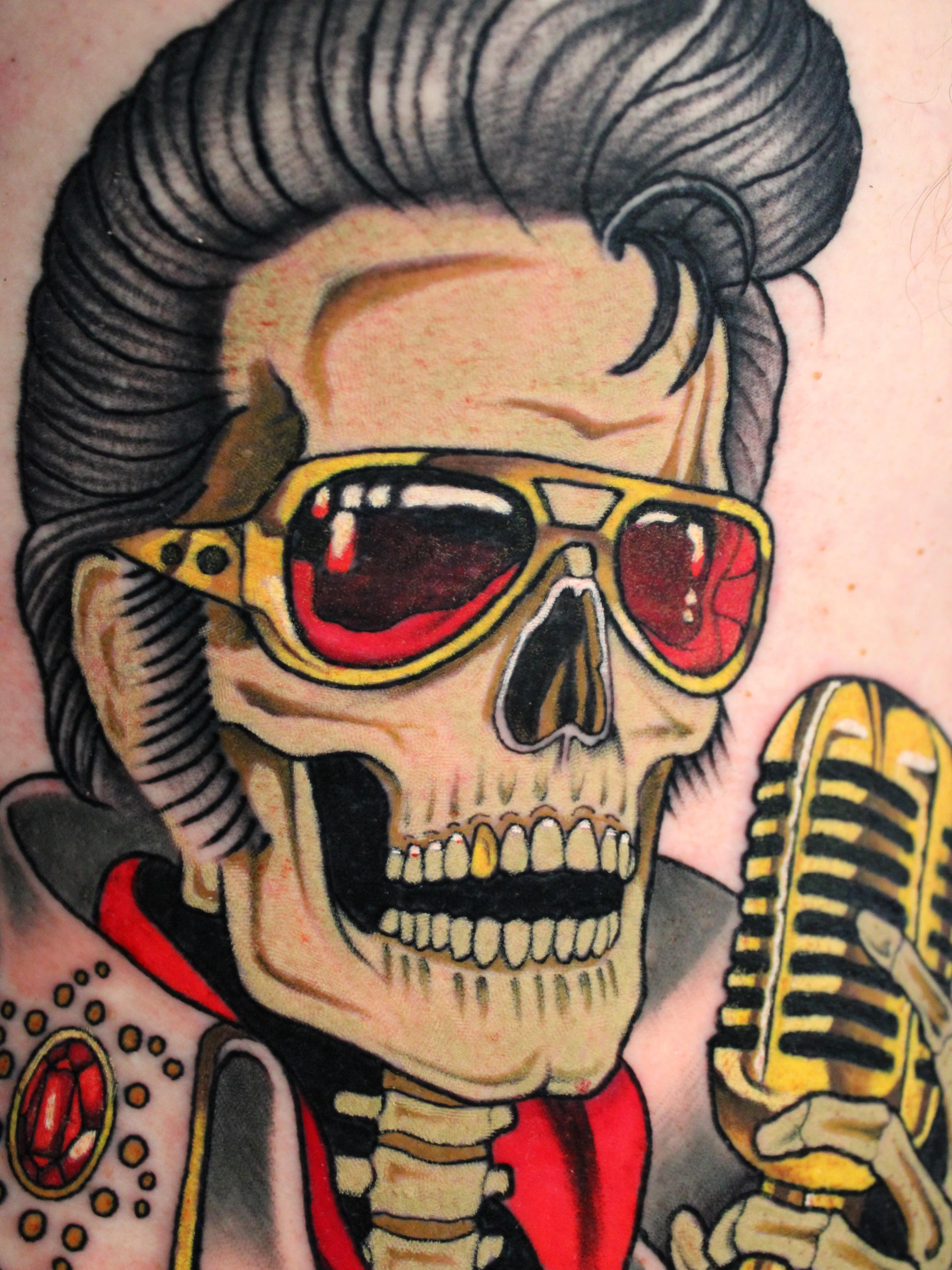 Skull with sunglasses American traditional tattoo on the head by Dylan Walker