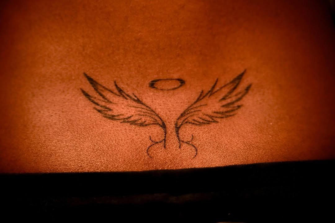 Angel wings with halo fine line tattoo on the torso by rylie :P