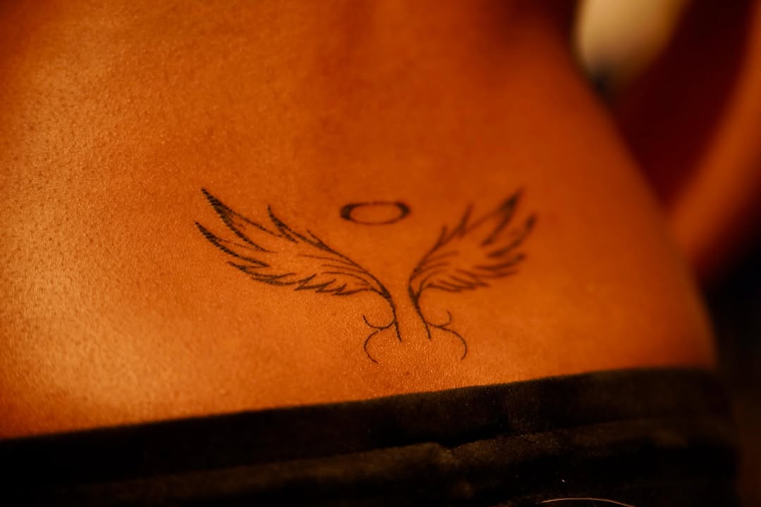 Angel wings with halo fine line tattoo on the chest by rylie :P