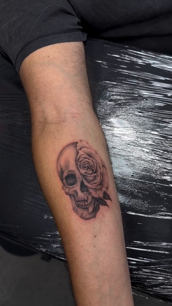 Skull and rose tattoo realism tattoo on the forearm by Lina Valentina, New York, New York