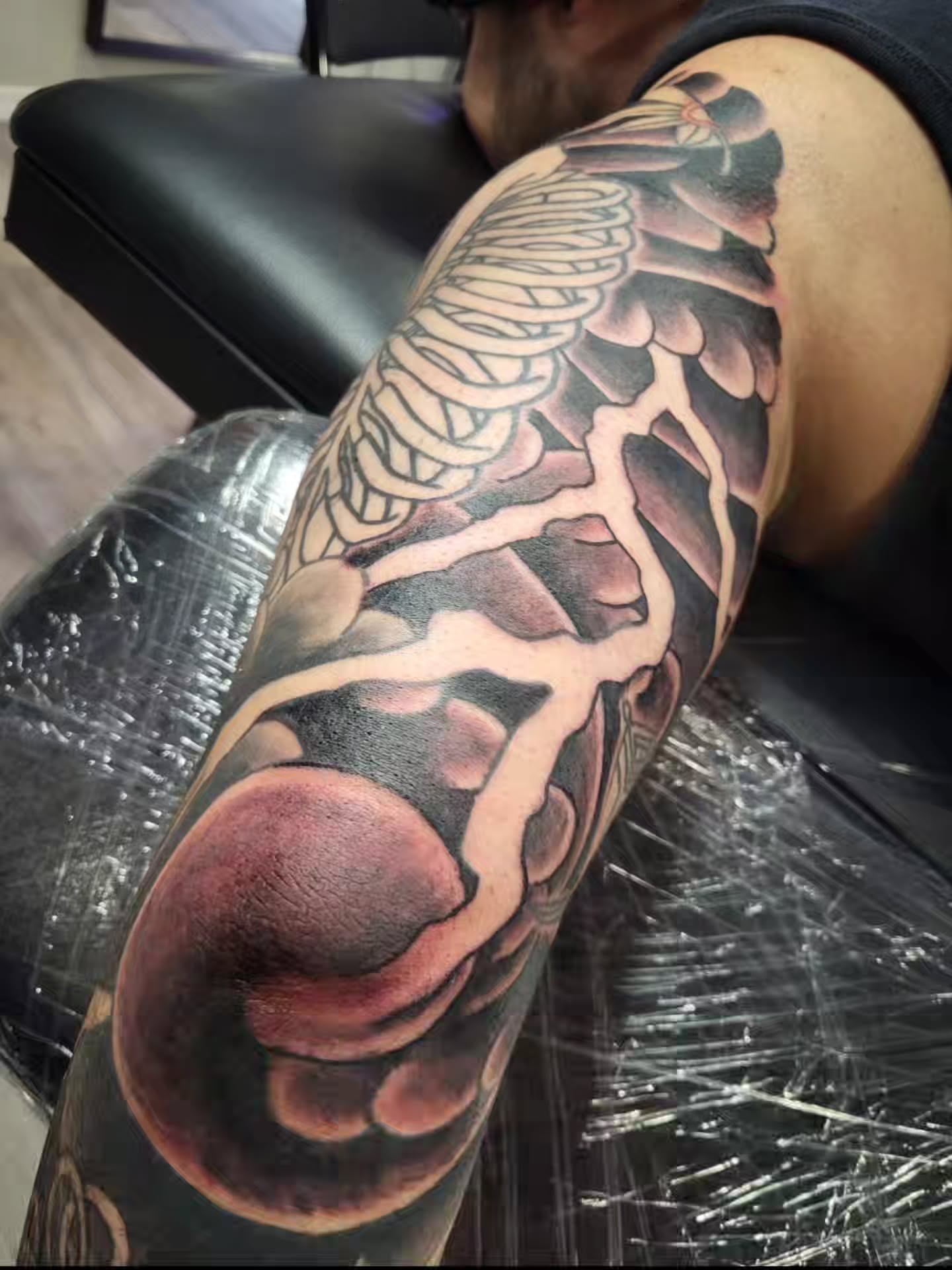 Anatomical structure realism tattoo on the upper arm by Sloan Smith