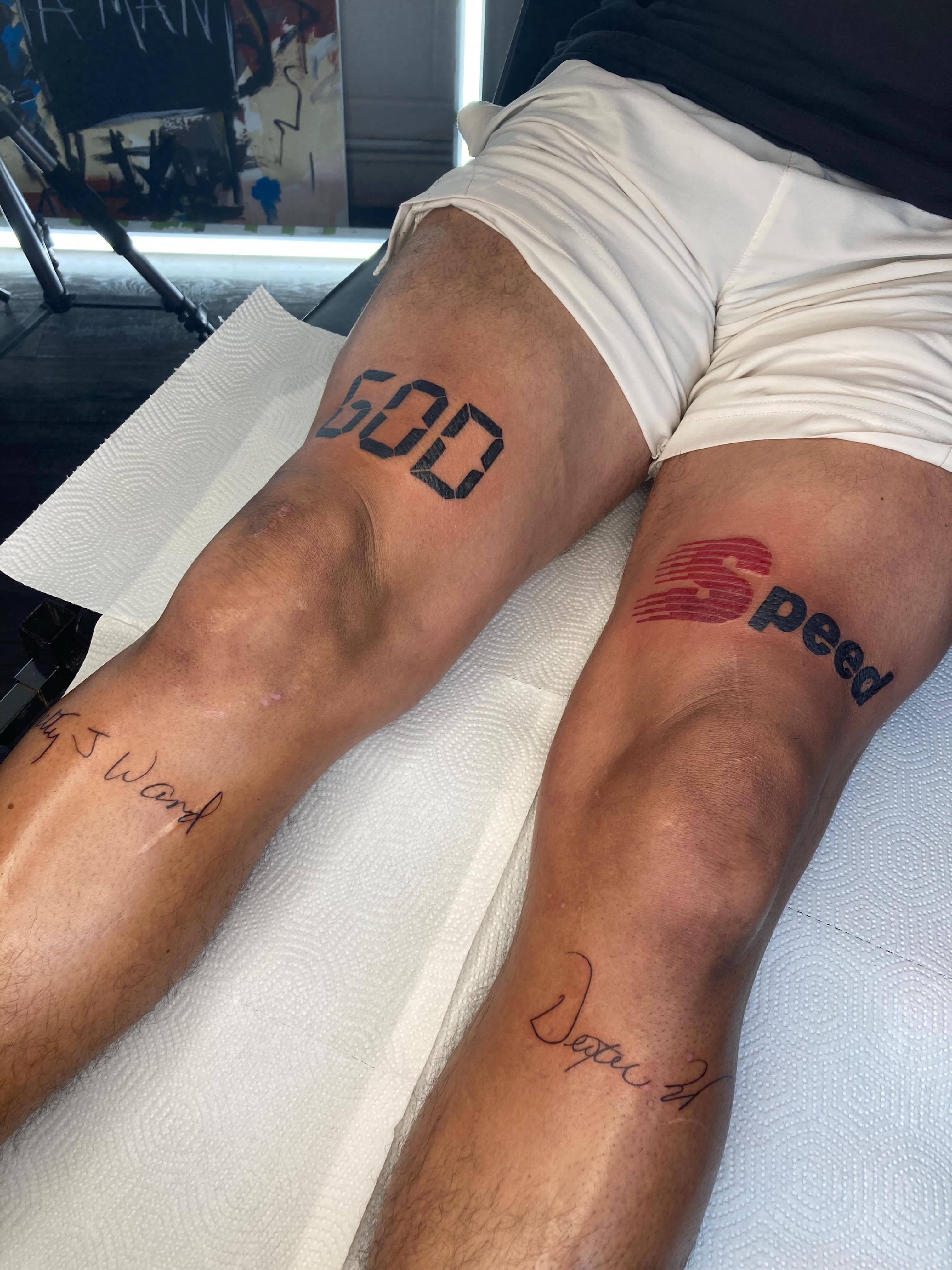 God lettering script tattoo on the leg by Tattoo Artist