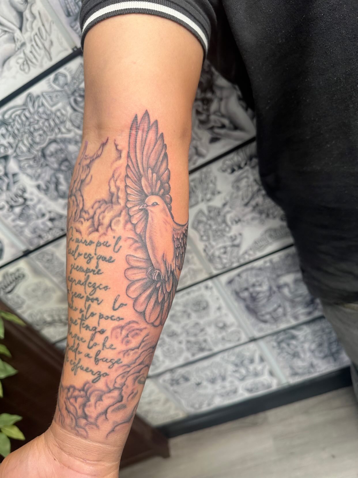 Bird and floral black and grey tattoo on the forearm by Ink by Hailey π