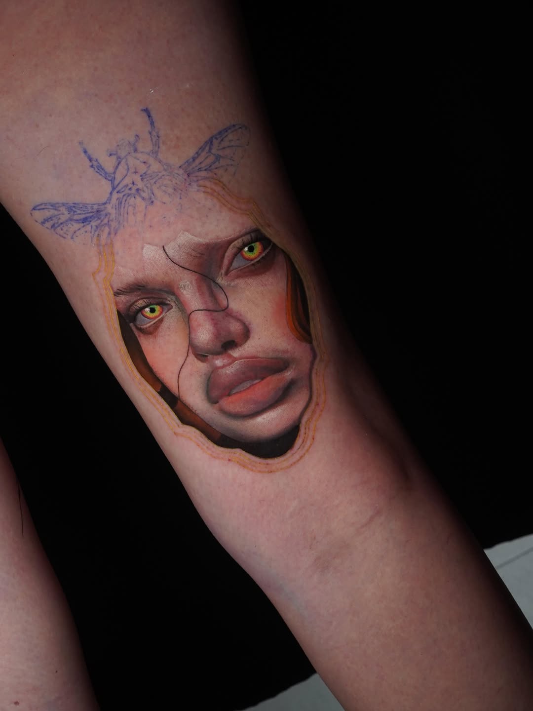Surreal portrait with insect elements surrealism tattoo on the forearm by orlando