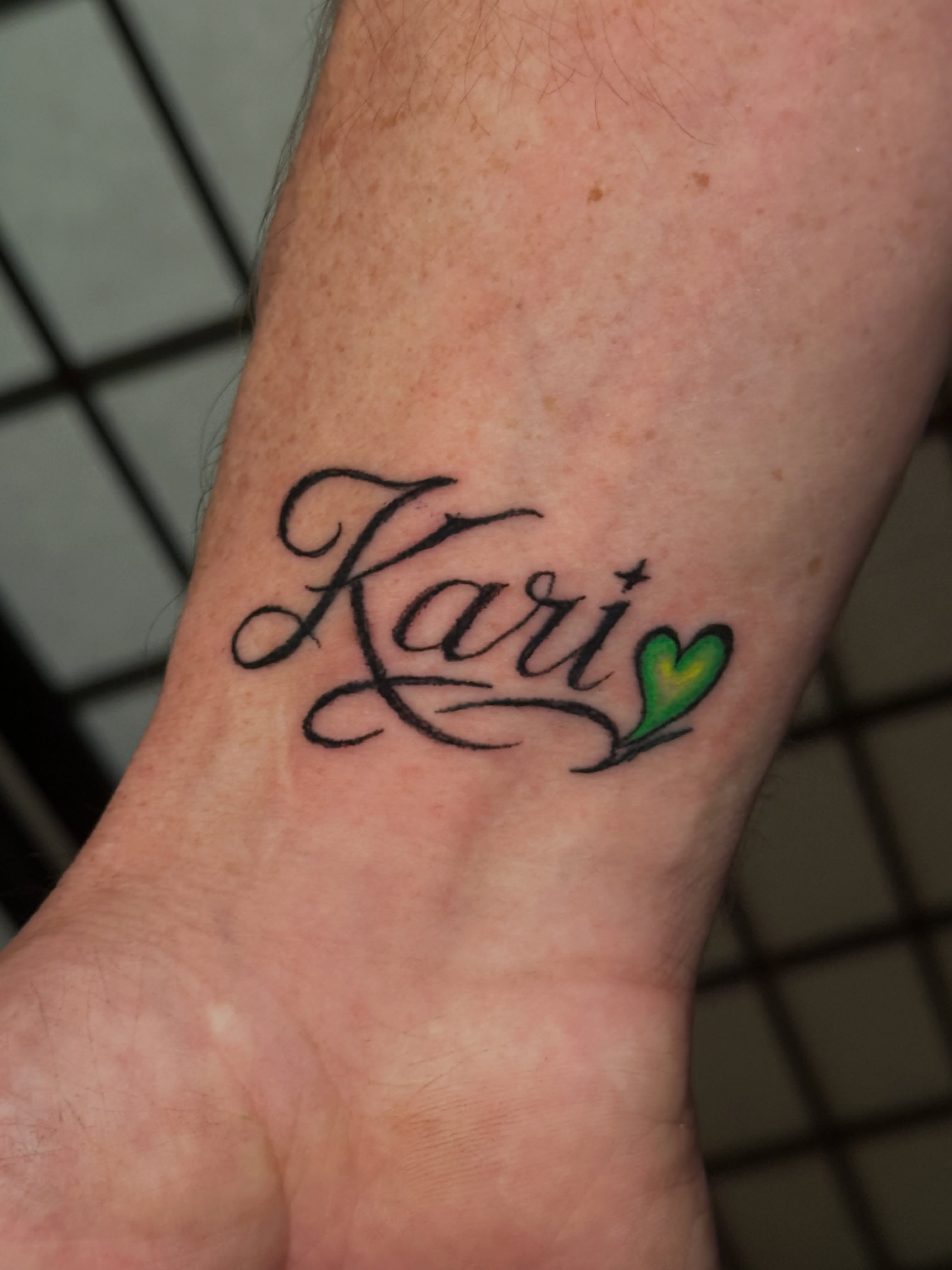 Kari lettering script tattoo on the forearm by Chris Whittaker Tattoo Artist