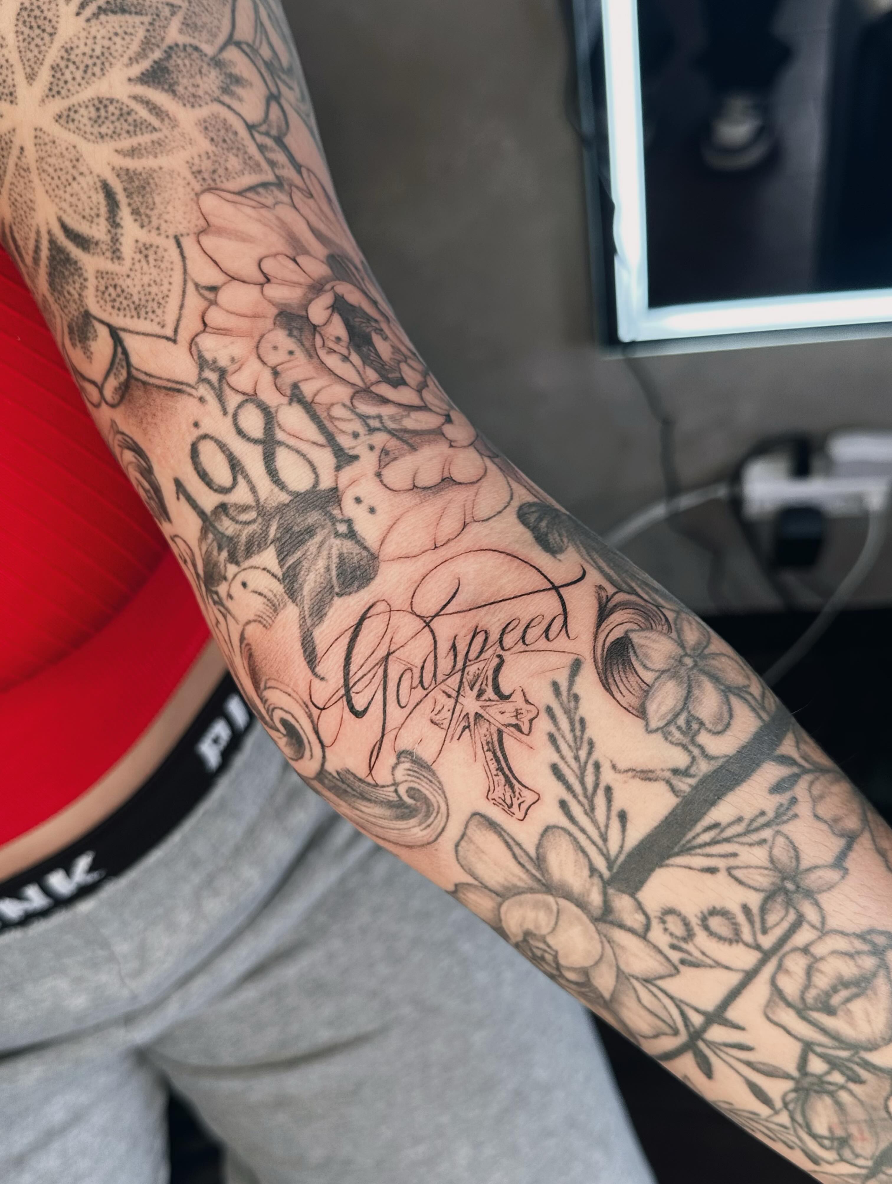 Floral arrangement dotwork tattoo on the forearm by Liv