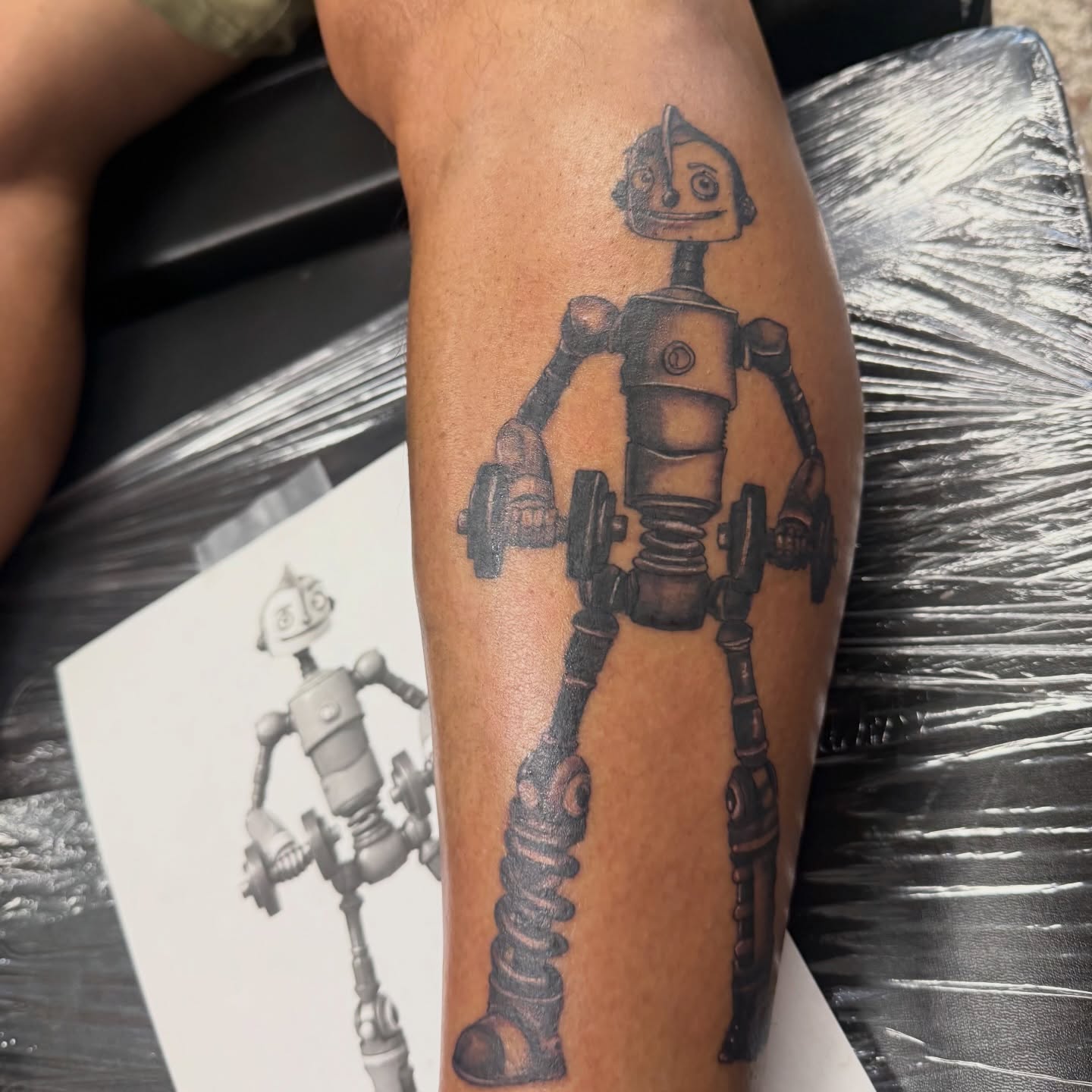 Robot black and grey tattoo on the forearm by Chuckthegirl