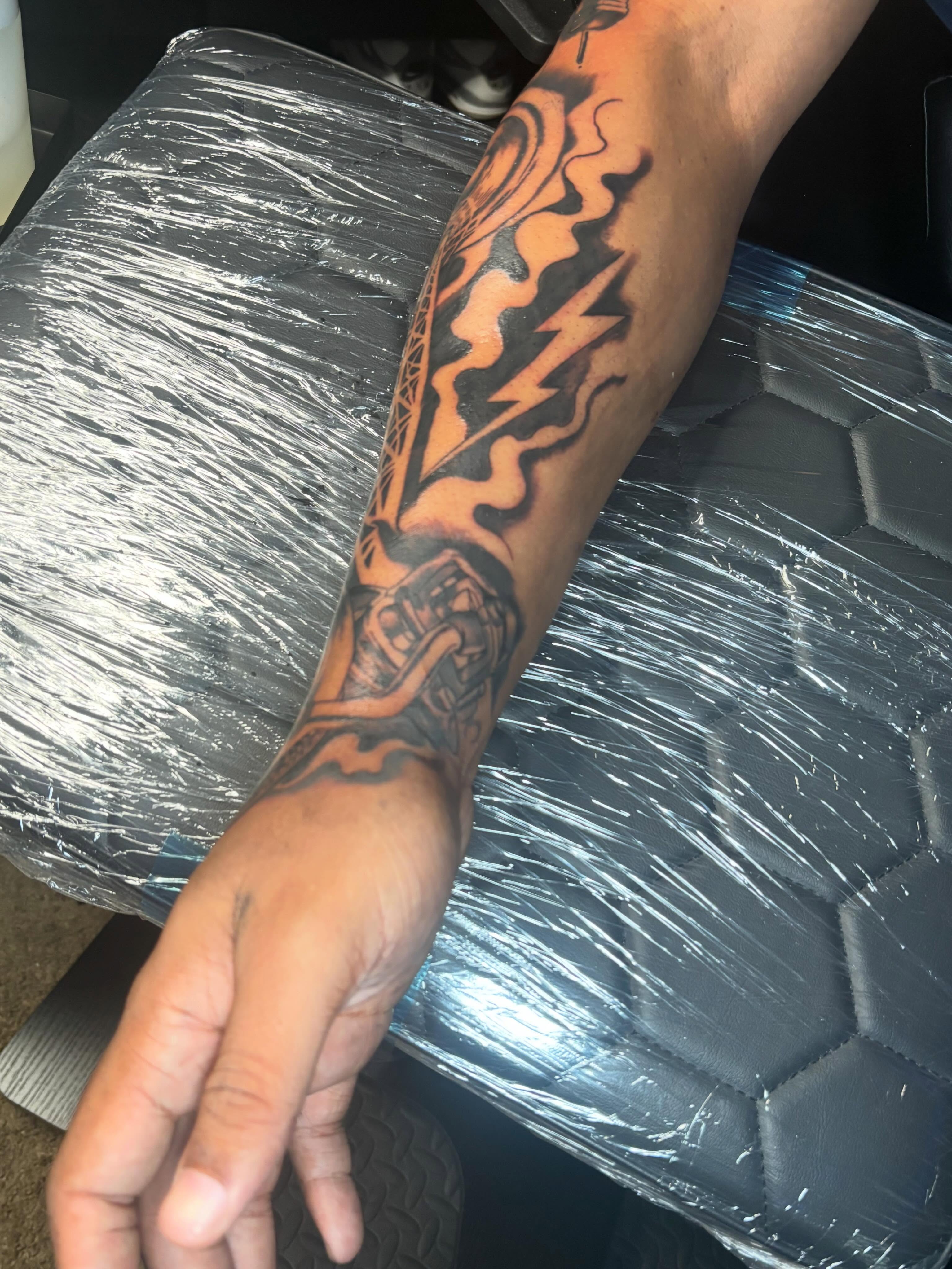 Tribal lightning bolt tribal tattoo on the forearm by Mr.K