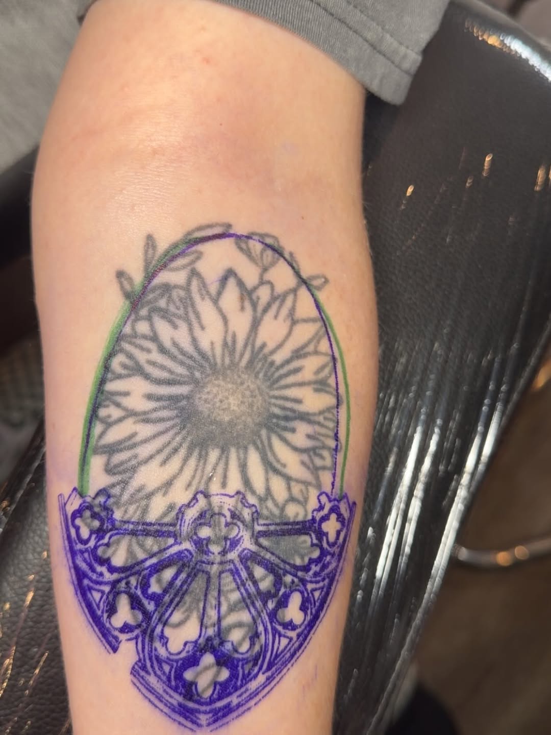 Flower and stained glass window geometric tattoo on the forearm by Natalie
