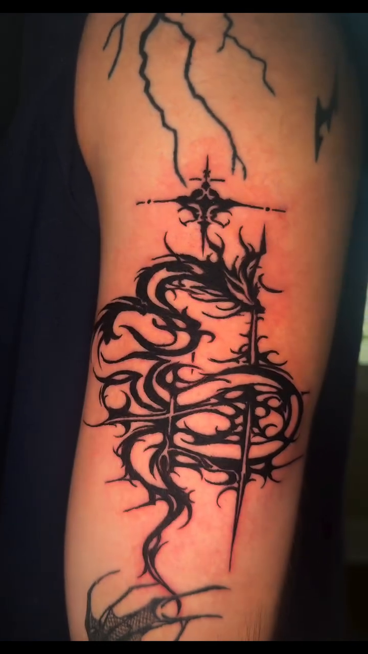 Blackwork snake with cross cyber sigilism tattoo on the forearm by InkedByJide Tattoo, Atlanta, Georgia