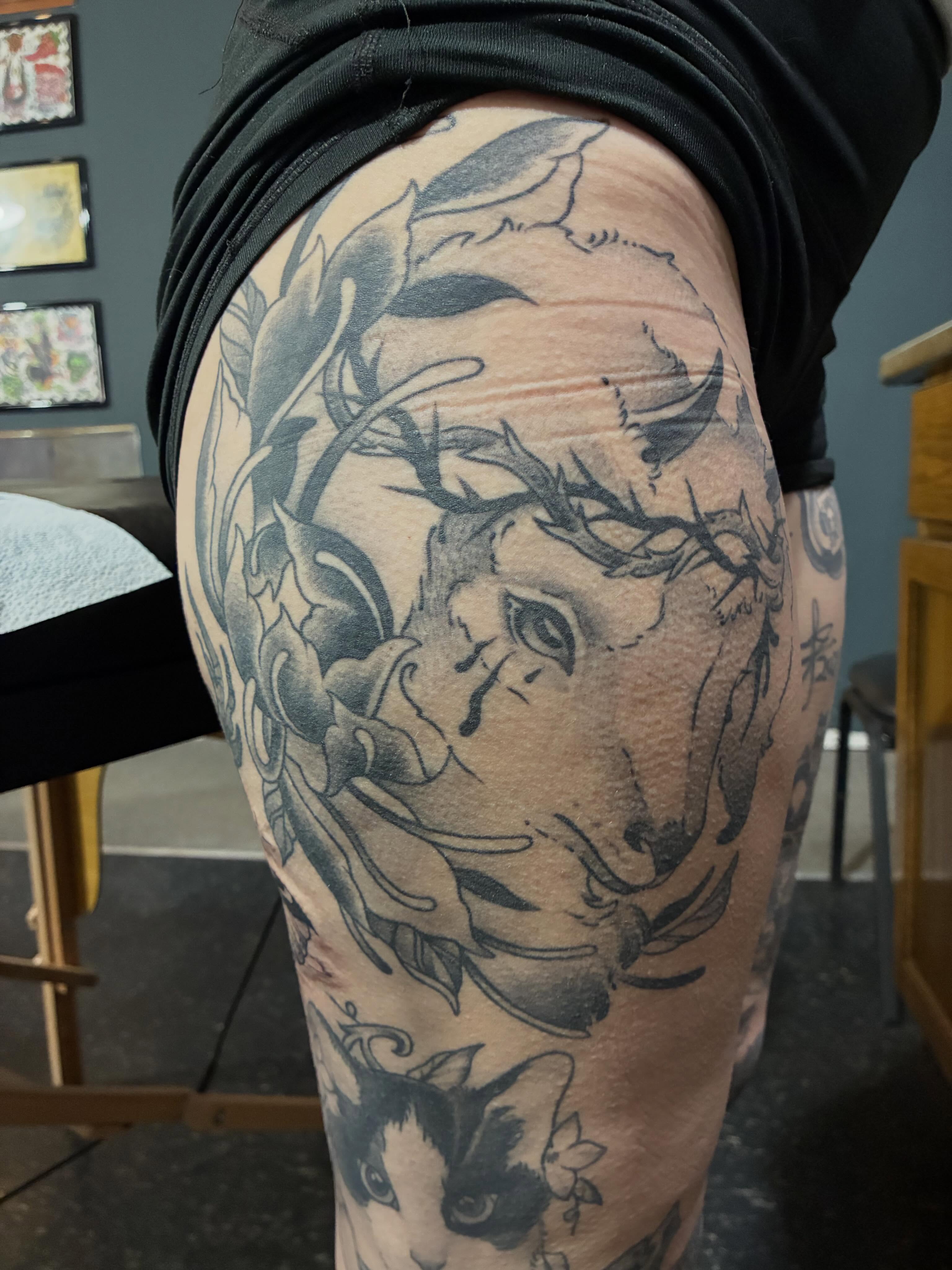 Religious figure with crown of thorns realism tattoo on the thigh by Natalie Spuhler