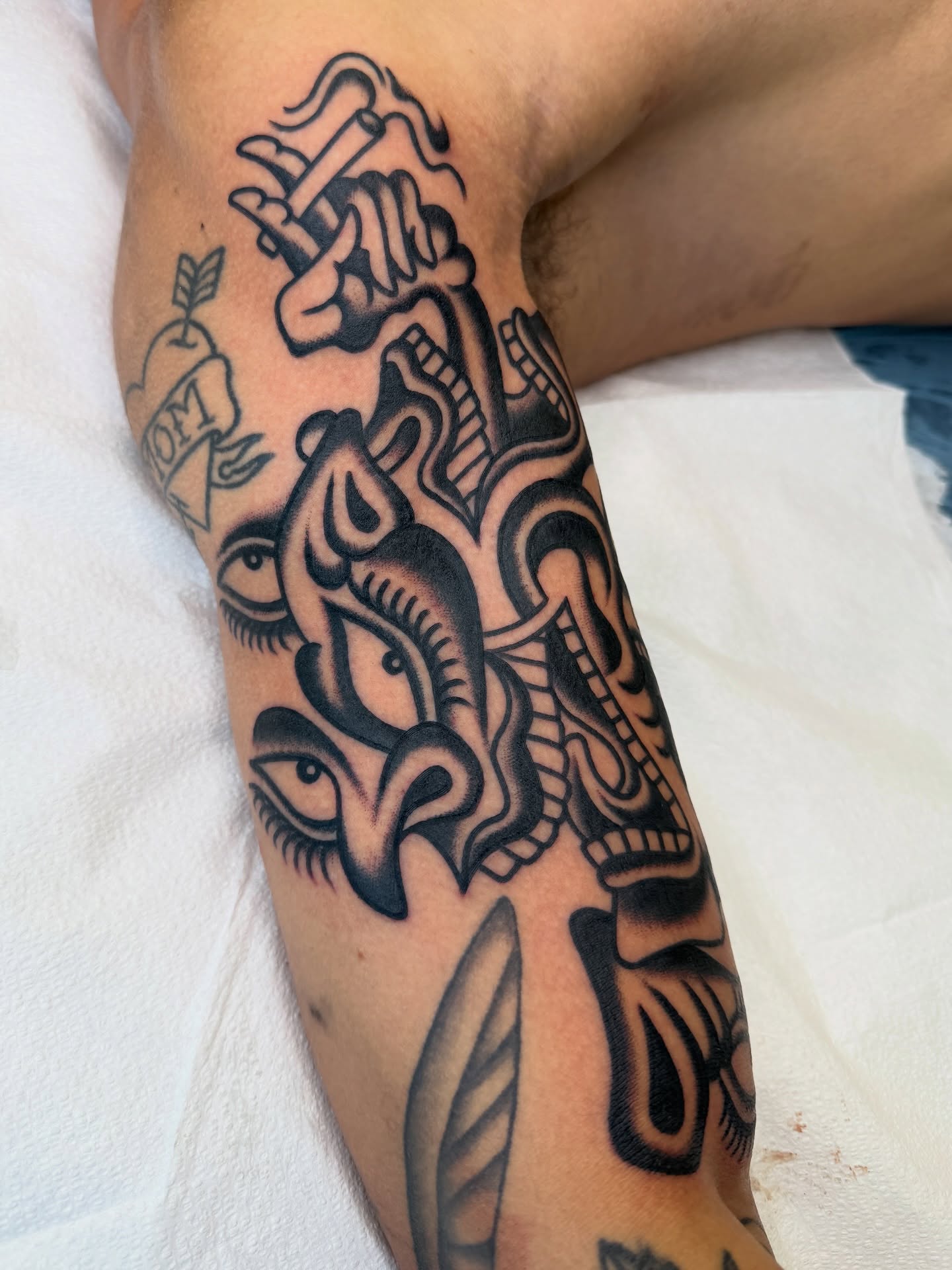Mythical creature tribal tattoo on the forearm by Nick Judkins Tattoo