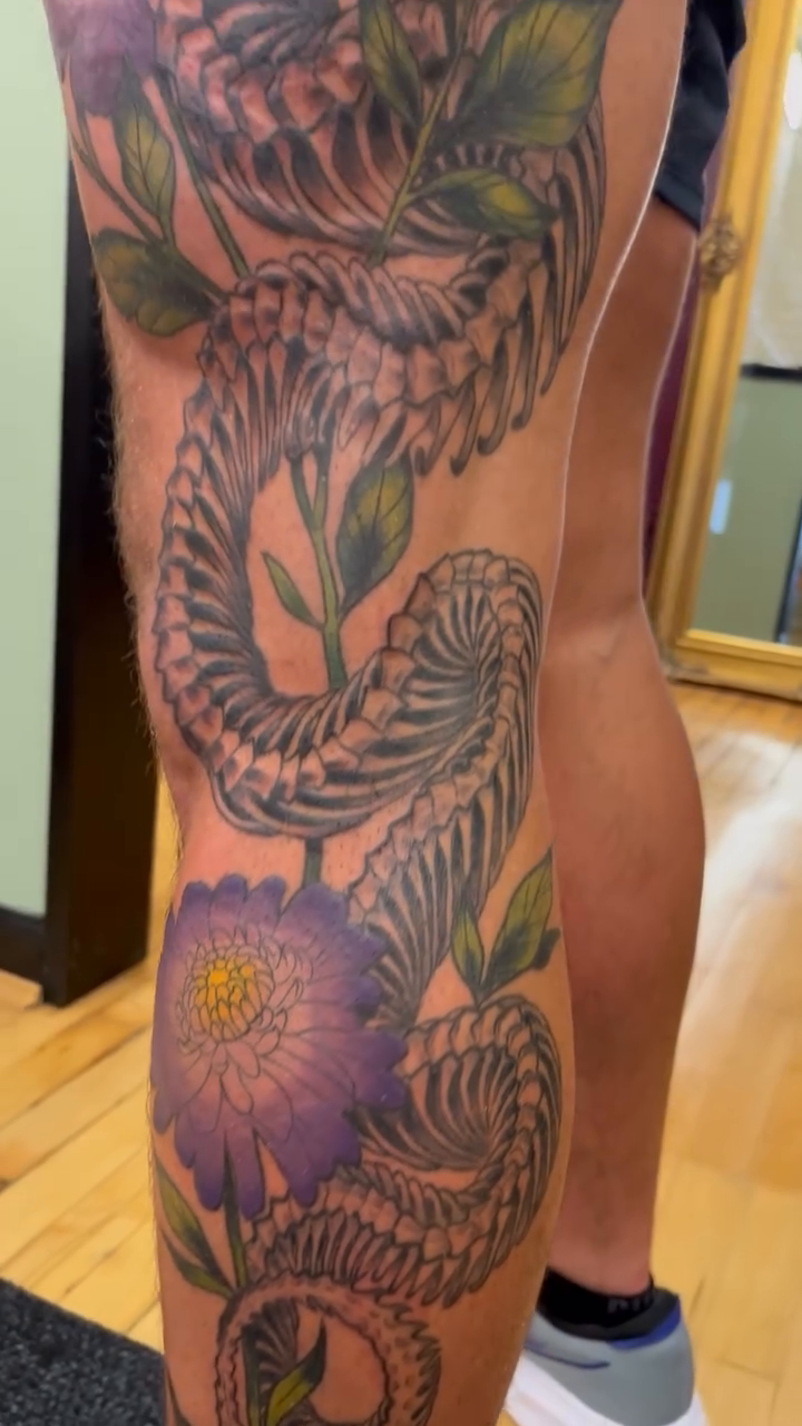 Skeleton snake with flowers Japanese tattoo on the leg by Megan Merrell (Butler)