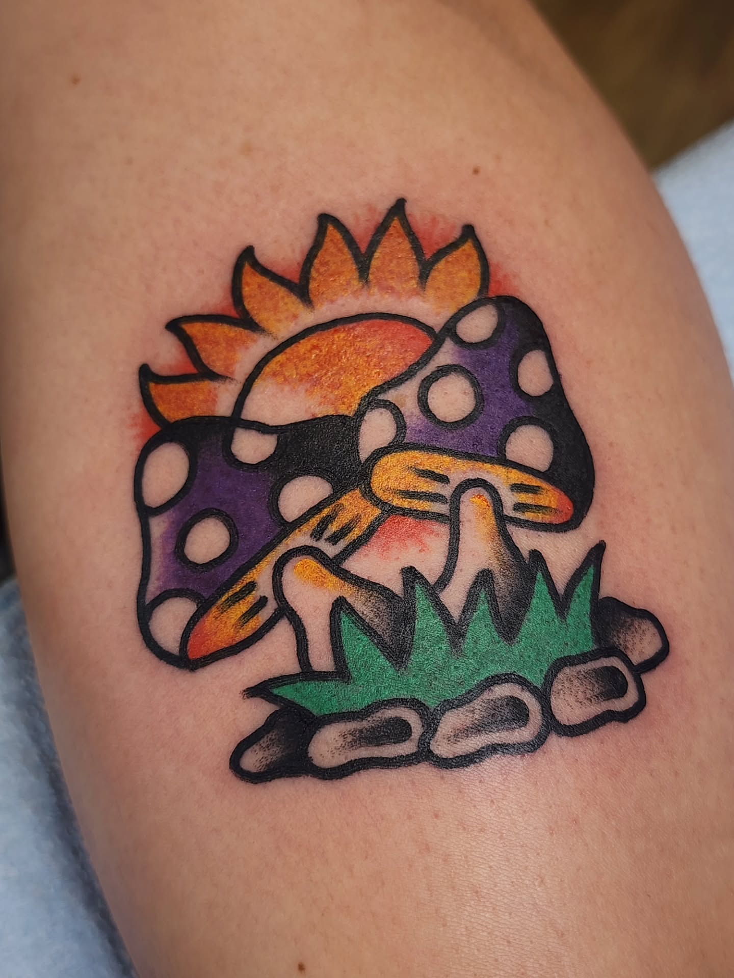 Mushrooms and sun American traditional tattoo on the thigh by πππππ