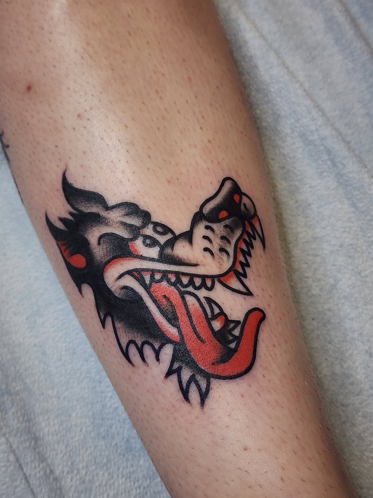 Dragon American traditional tattoo on the forearm by πππππ