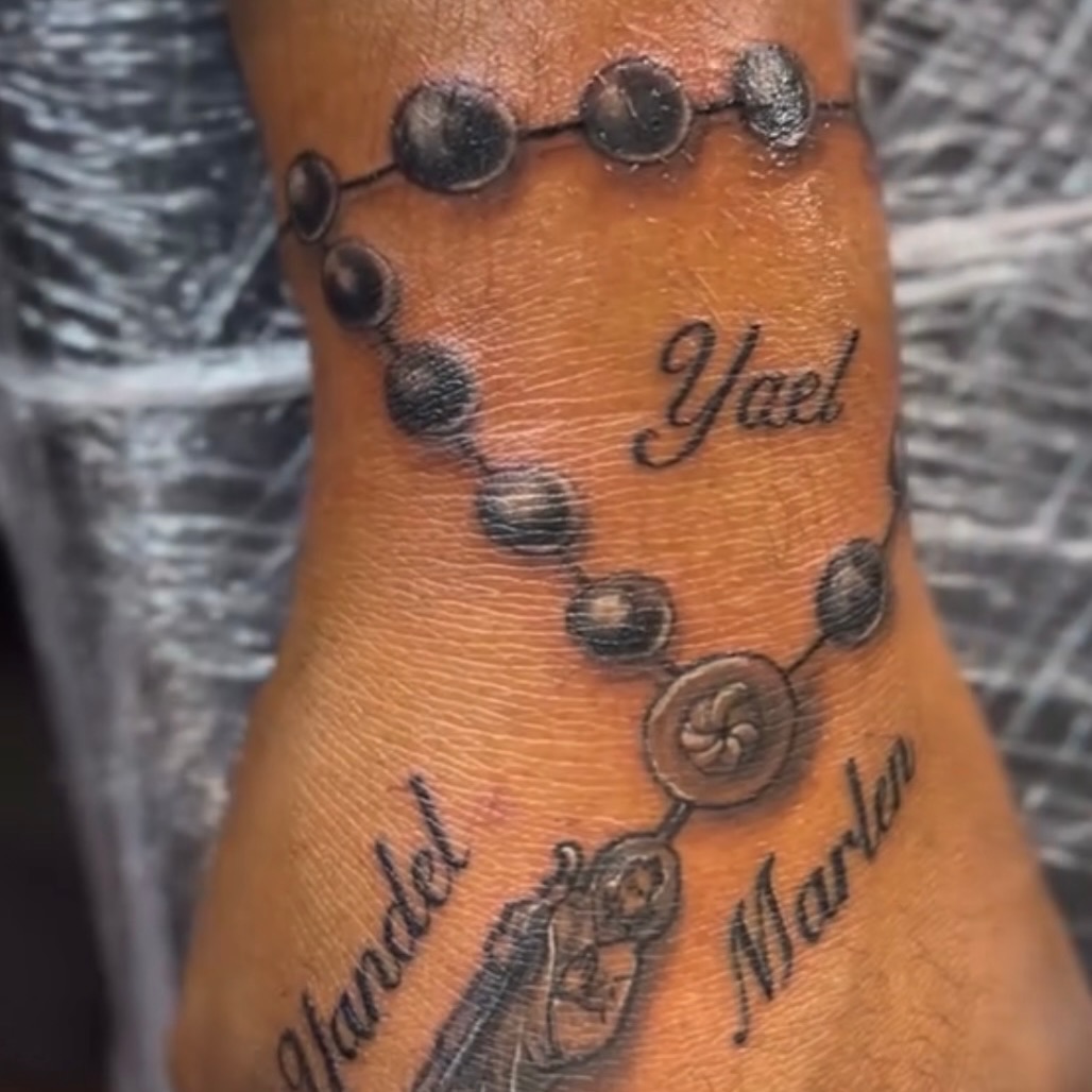 Rosary beads with names lettering tattoo on the forearm by Vanessa - Dallas Artist