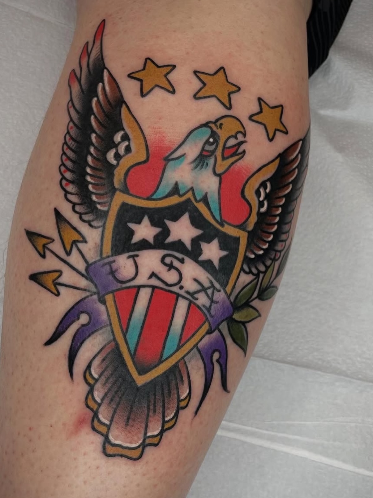 Eagle shield American traditional tattoo on the thigh by Dave Kruseman
