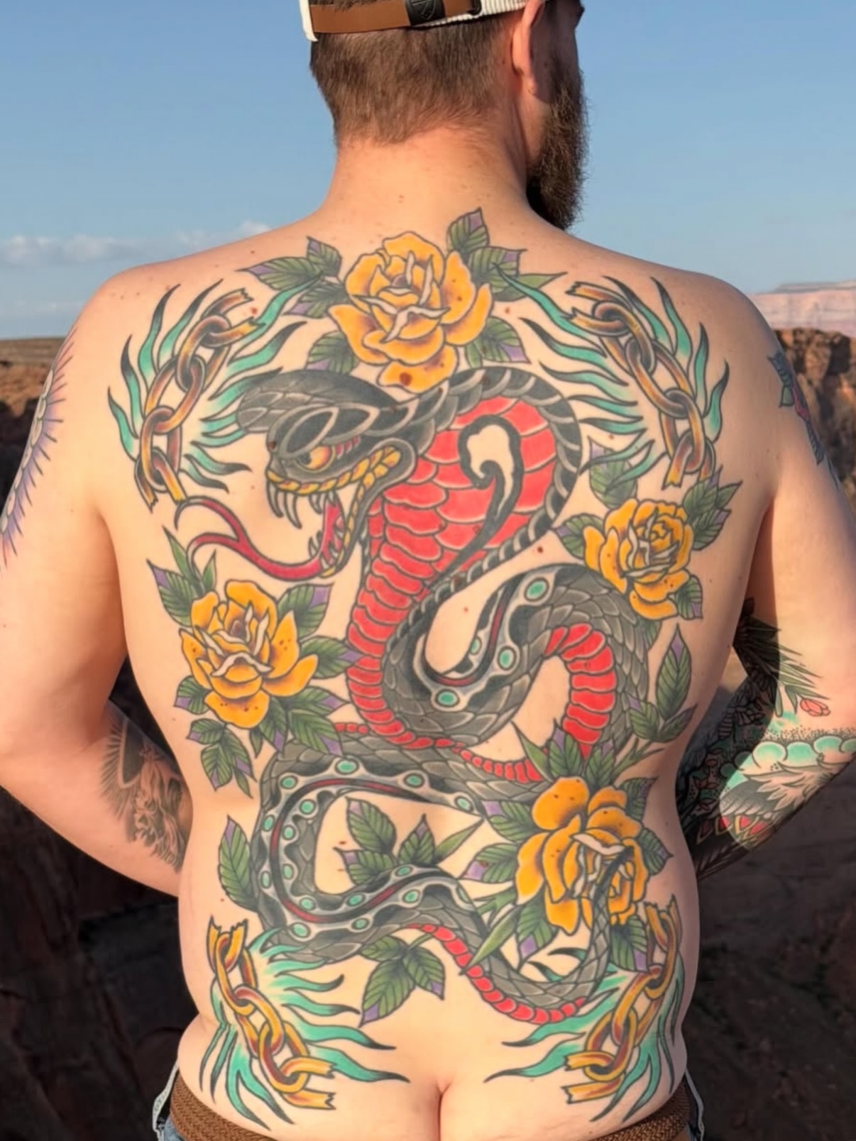 Dragon and roses American traditional tattoo on the back by Dave Kruseman