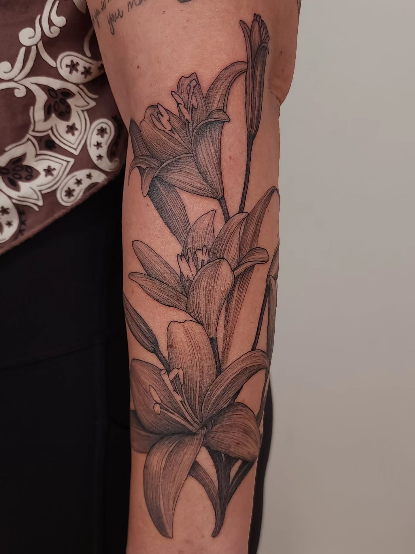 Lilies black and grey tattoo on the forearm by ๐ฏ๐๐๐๐ ๐ท๐๐๐๐
