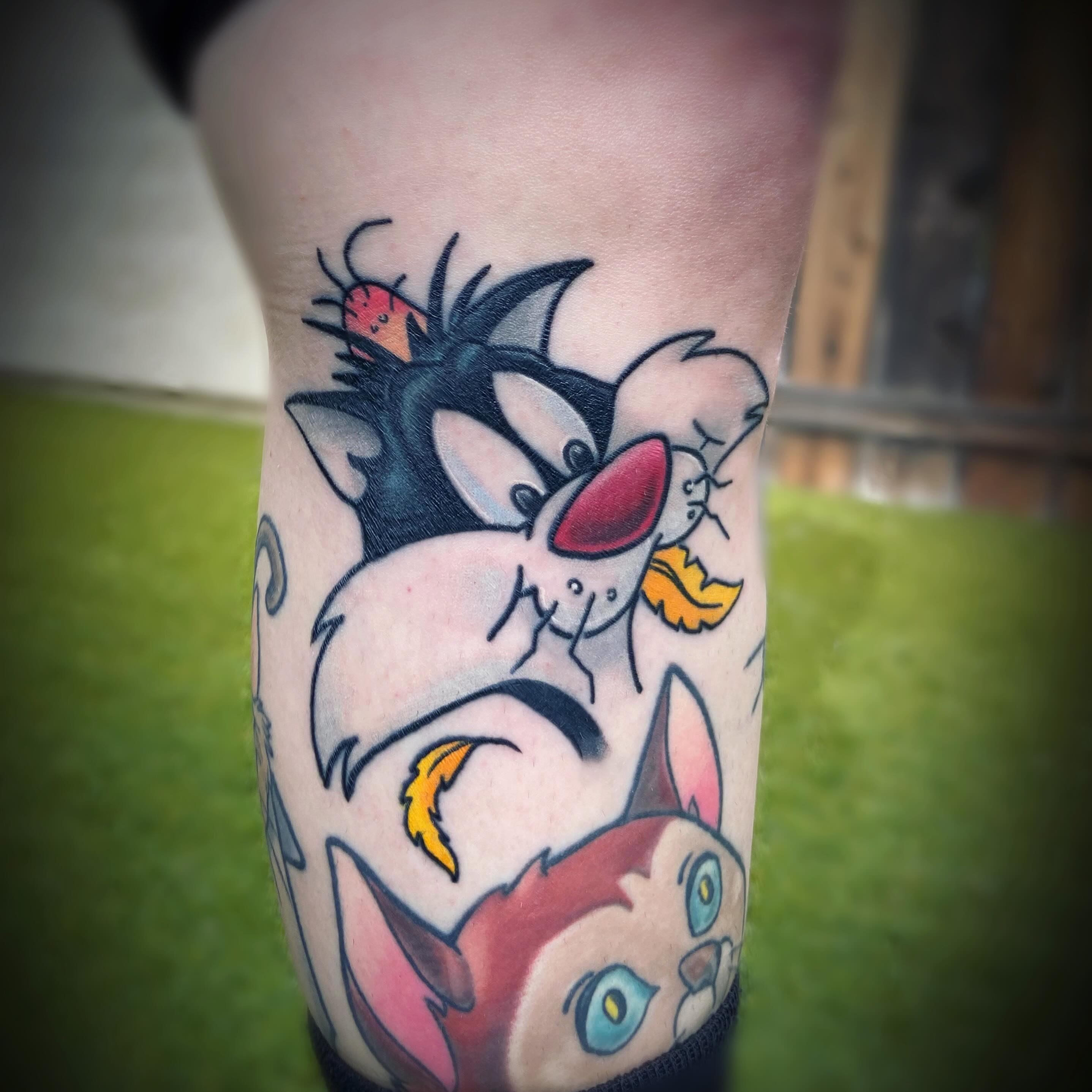 Looney tunes characters American traditional tattoo on the forearm by San Diego Tattoo Artist