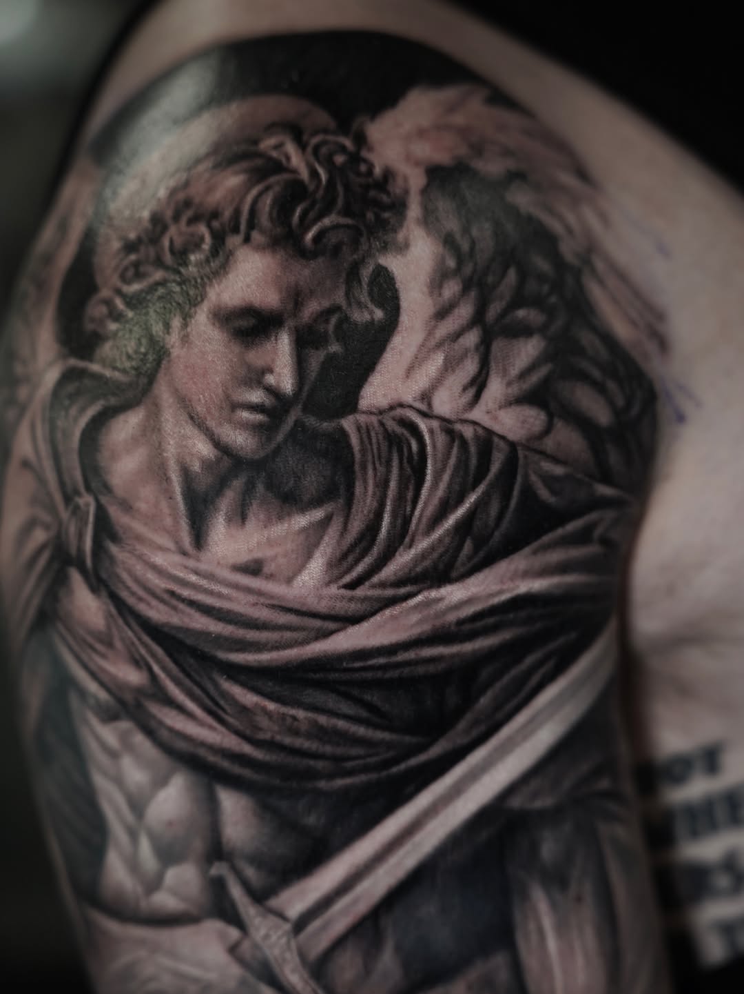 Angelic figure with sword realism tattoo on the shoulder by Nelson Tellez