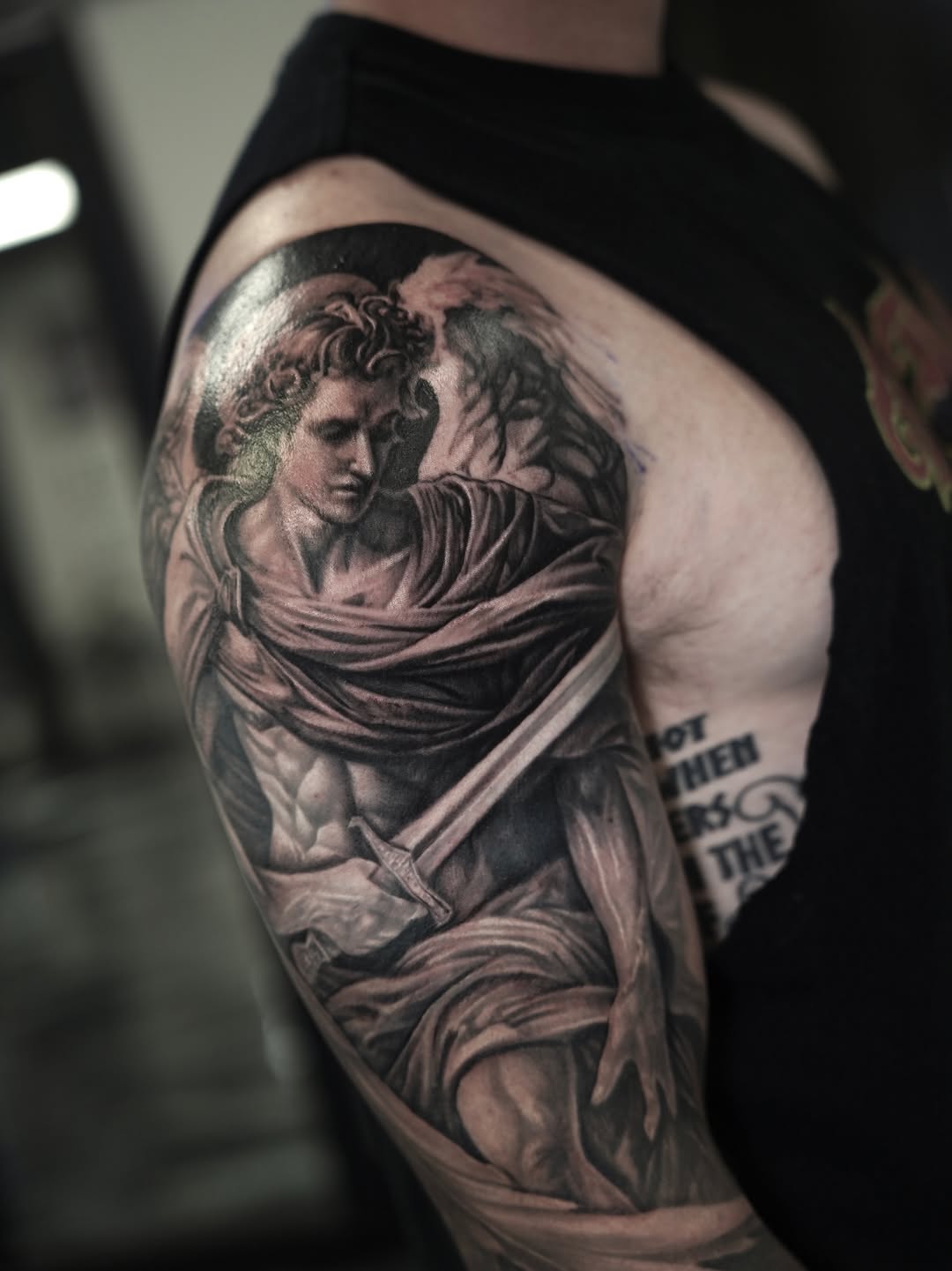 Angel with sword realism tattoo on the shoulder by Nelson Tellez