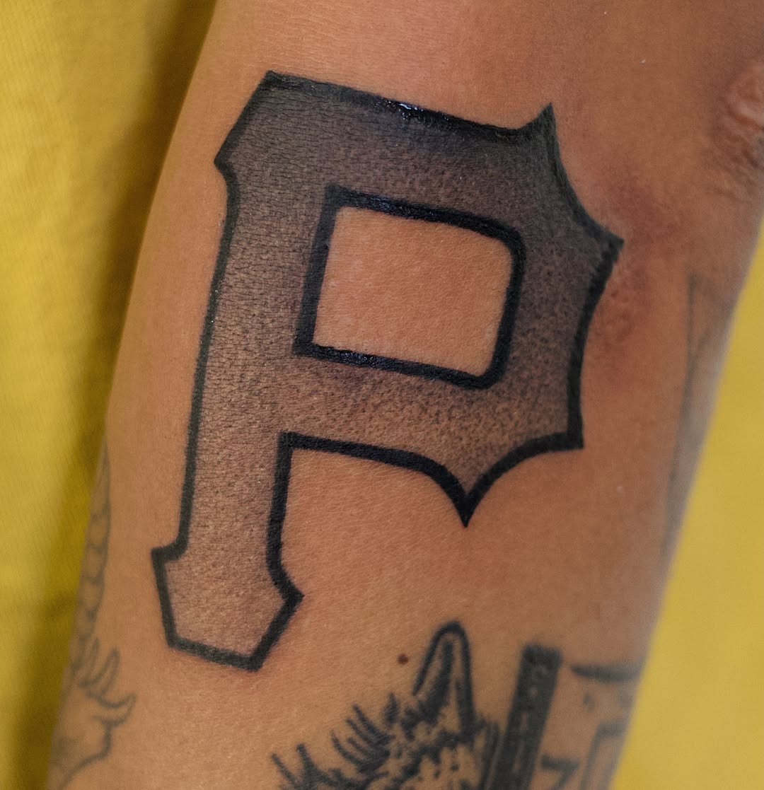Pittsburgh Pirates logo black and grey tattoo on the forearm by @lovechasetattoo