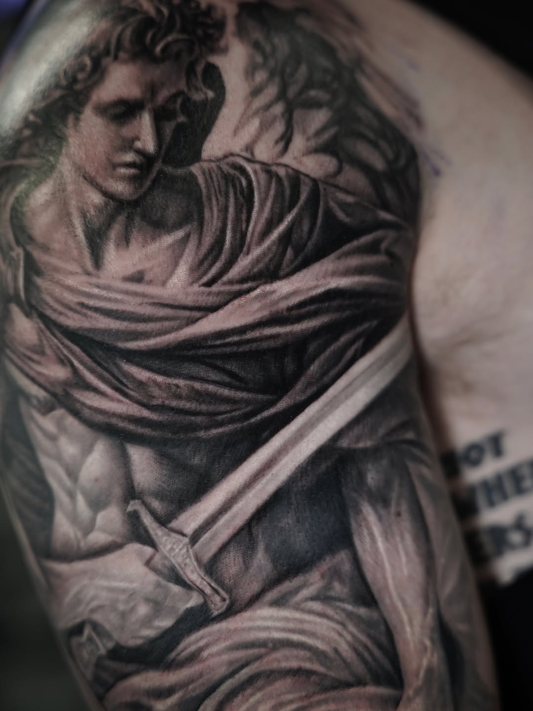 Angel with sword realism tattoo on the shoulder by Nelson Tellez