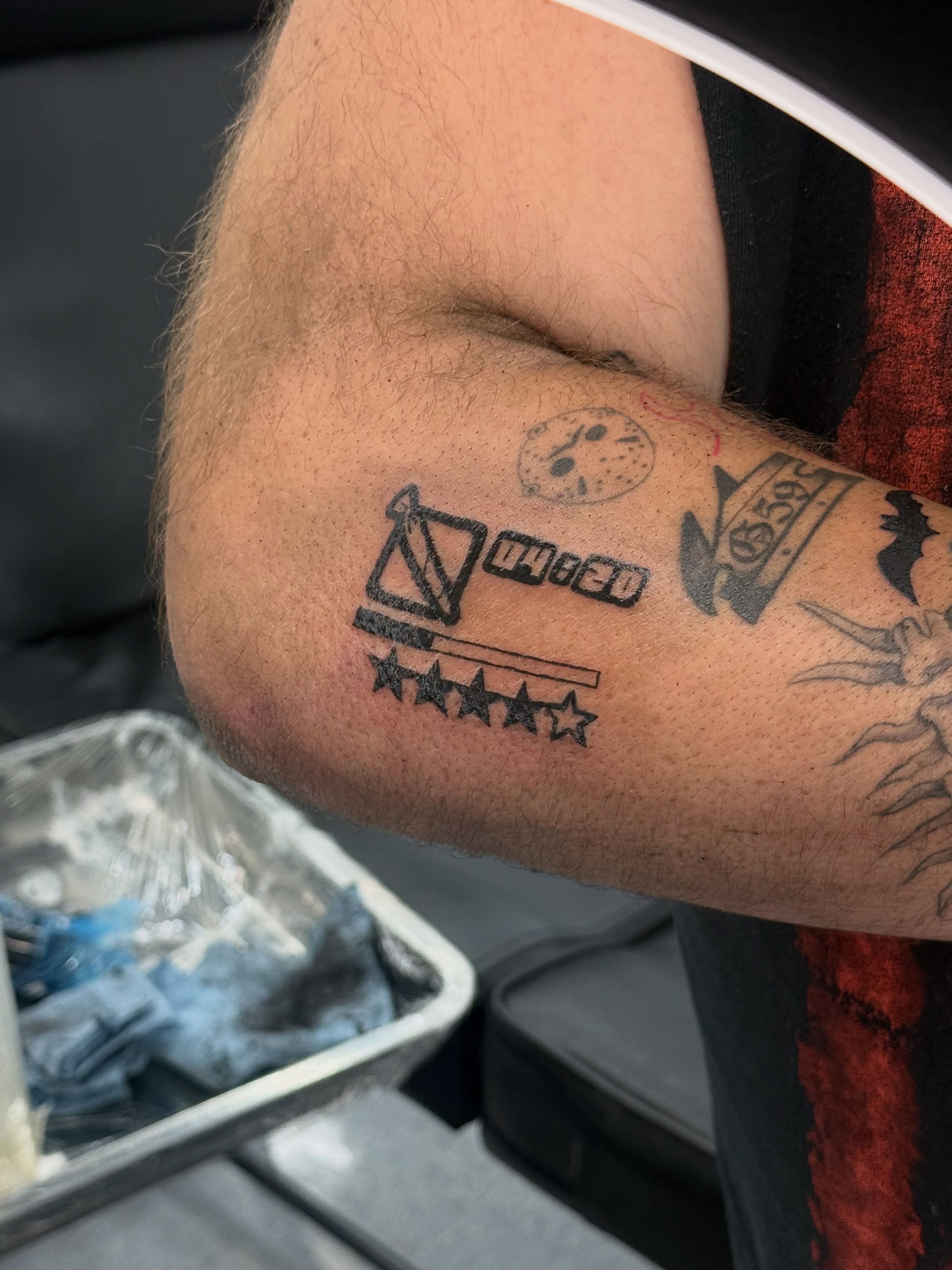 Movie poster geometric tattoo on the forearm by ⠀Greave