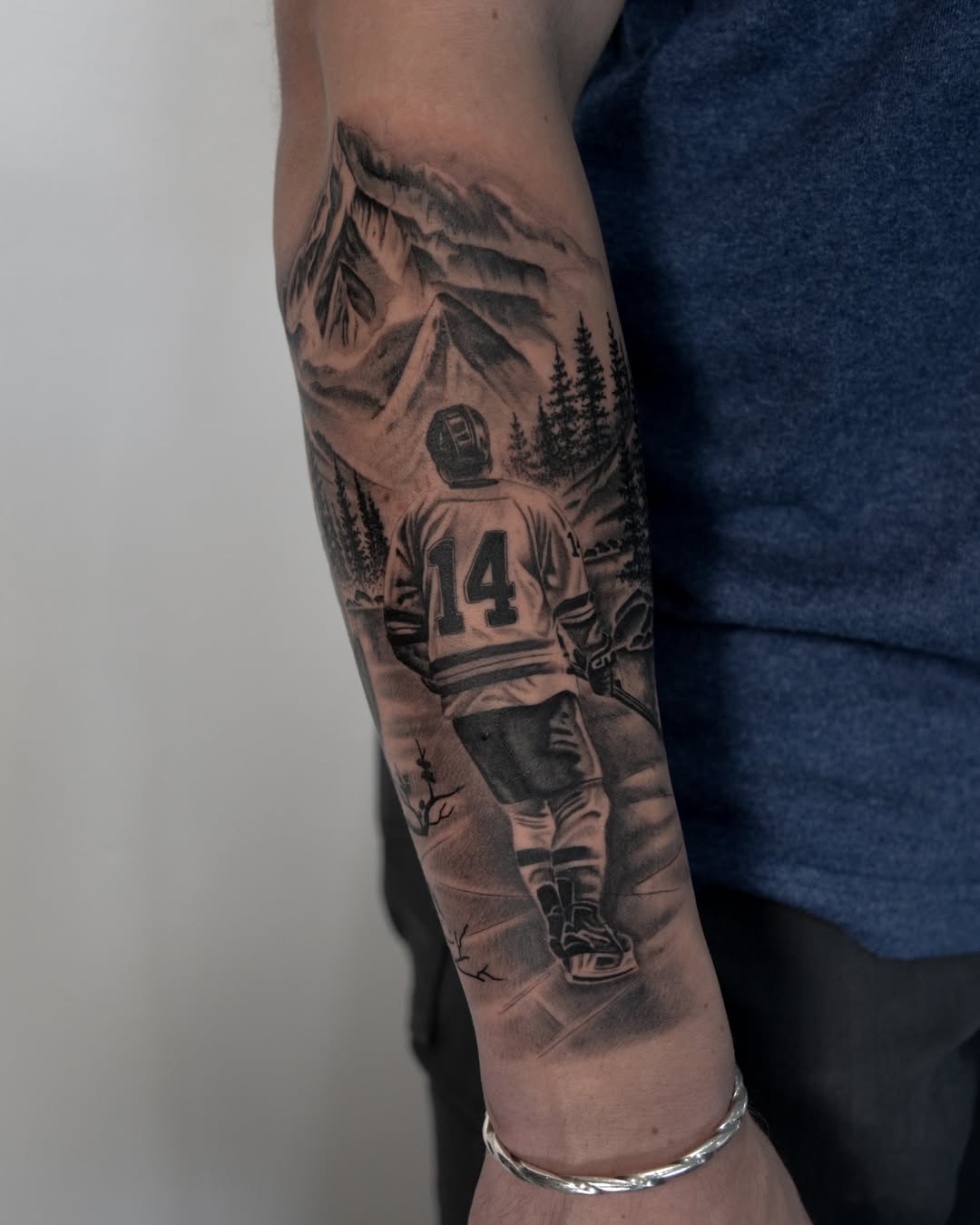 Hockey player realism tattoo on the forearm by zak brochu, Windsor, Ontario
