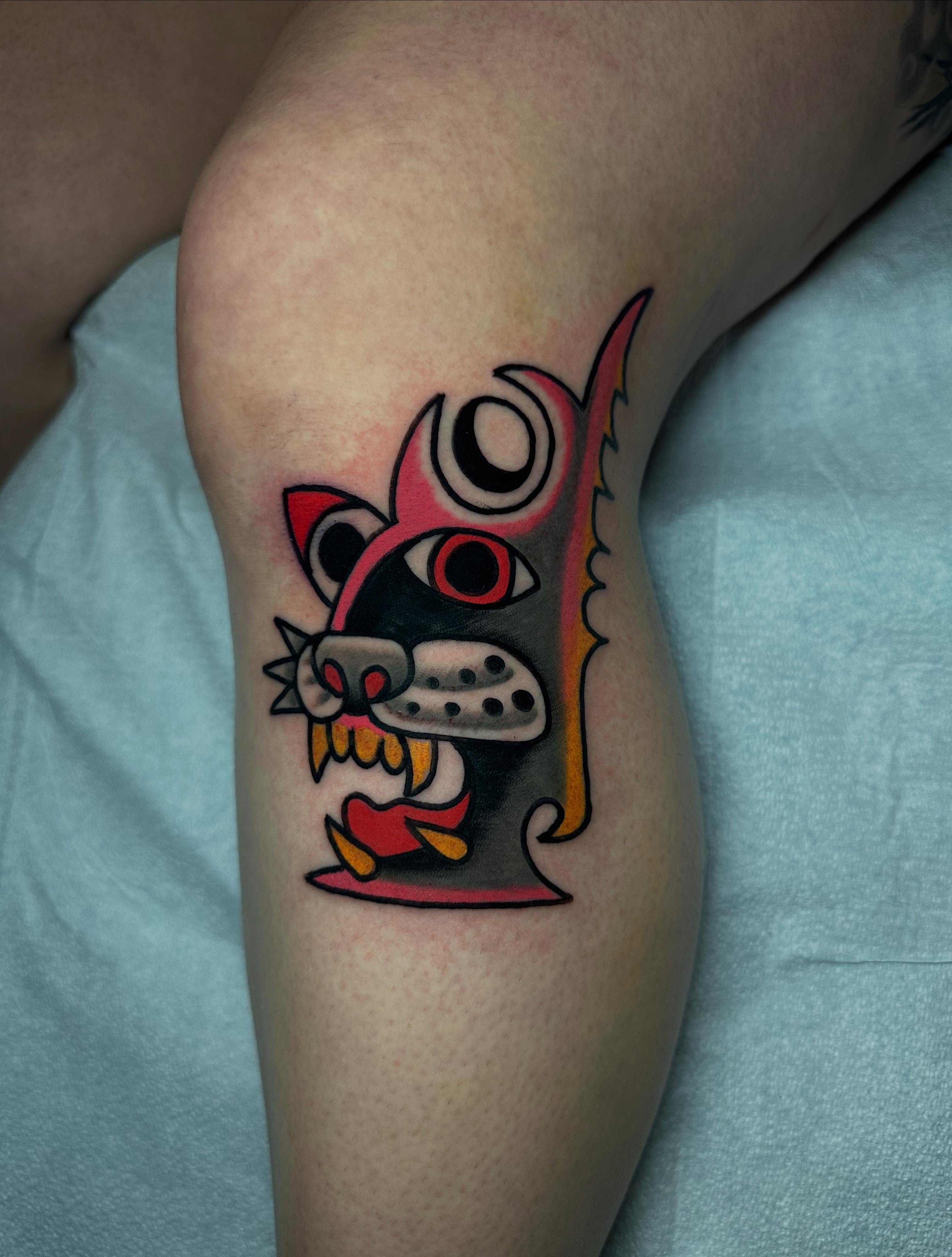 Cat American traditional tattoo on the thigh by Chris Bishop