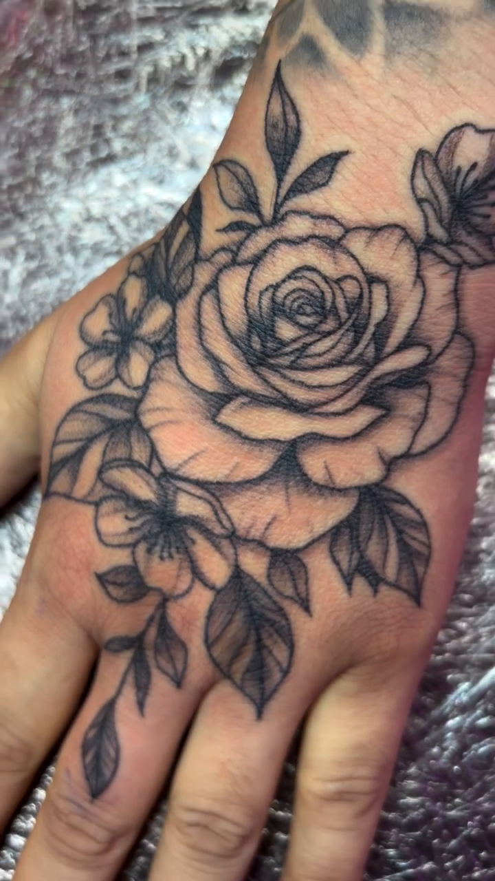 Rose and floral hand tattoo dotwork tattoo on the hand by Vegas Tattoo Mommy ๐๐, Las Vegas, Nevada